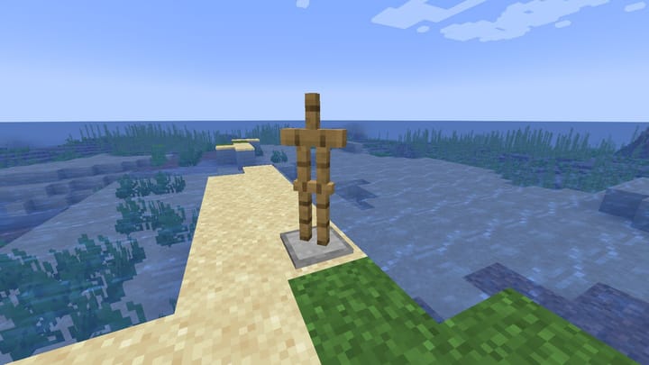 How to give armor stands weapons in Minecraft