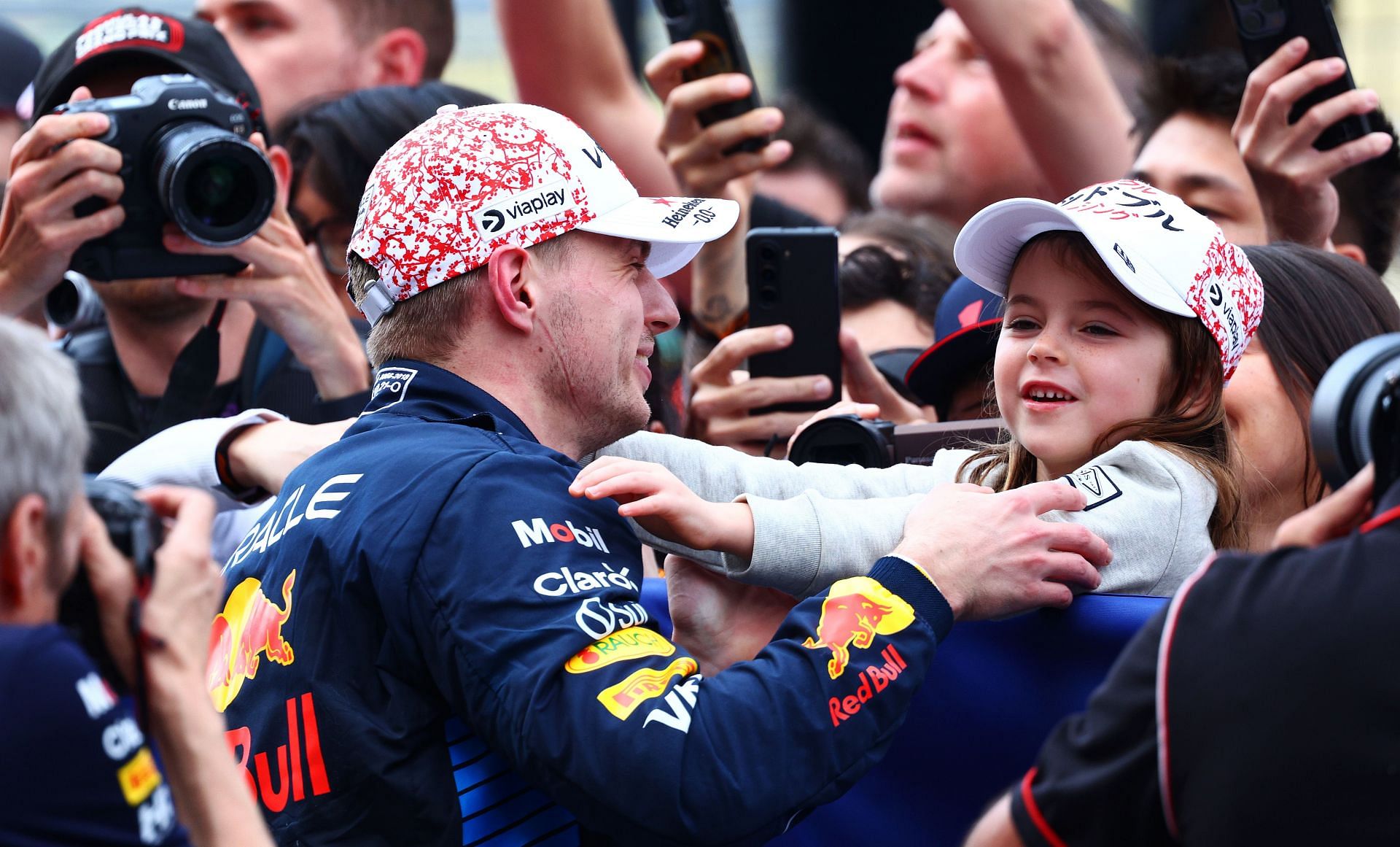 SUZUKA, JAPAN - APRIL 07: Race winner Max Verstappen of the Netherlands and Oracle Red Bull Racing celebrates with Penelope Piquet in parc ferme during the F1 Grand Prix of Japan at Suzuka International Racing Course on April 07, 2024 in Suzuka, Japan. (Photo by Clive Rose - Formula 1/Formula 1 via Getty Images)