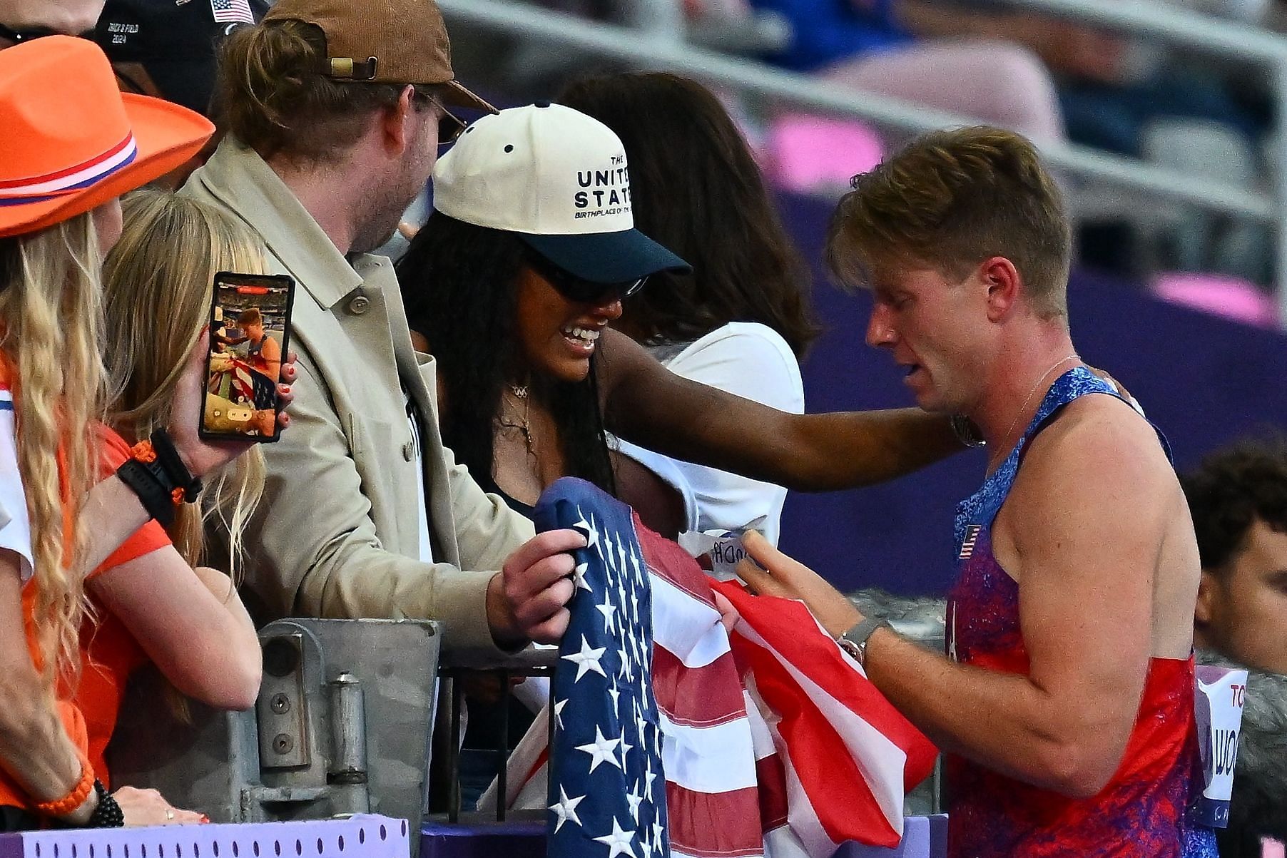 Hunter Woodhall celebrates with his wife Tara Davis-Woodhall at Paris Paralympics. (Photo by Marco Mantovani/Getty Images)