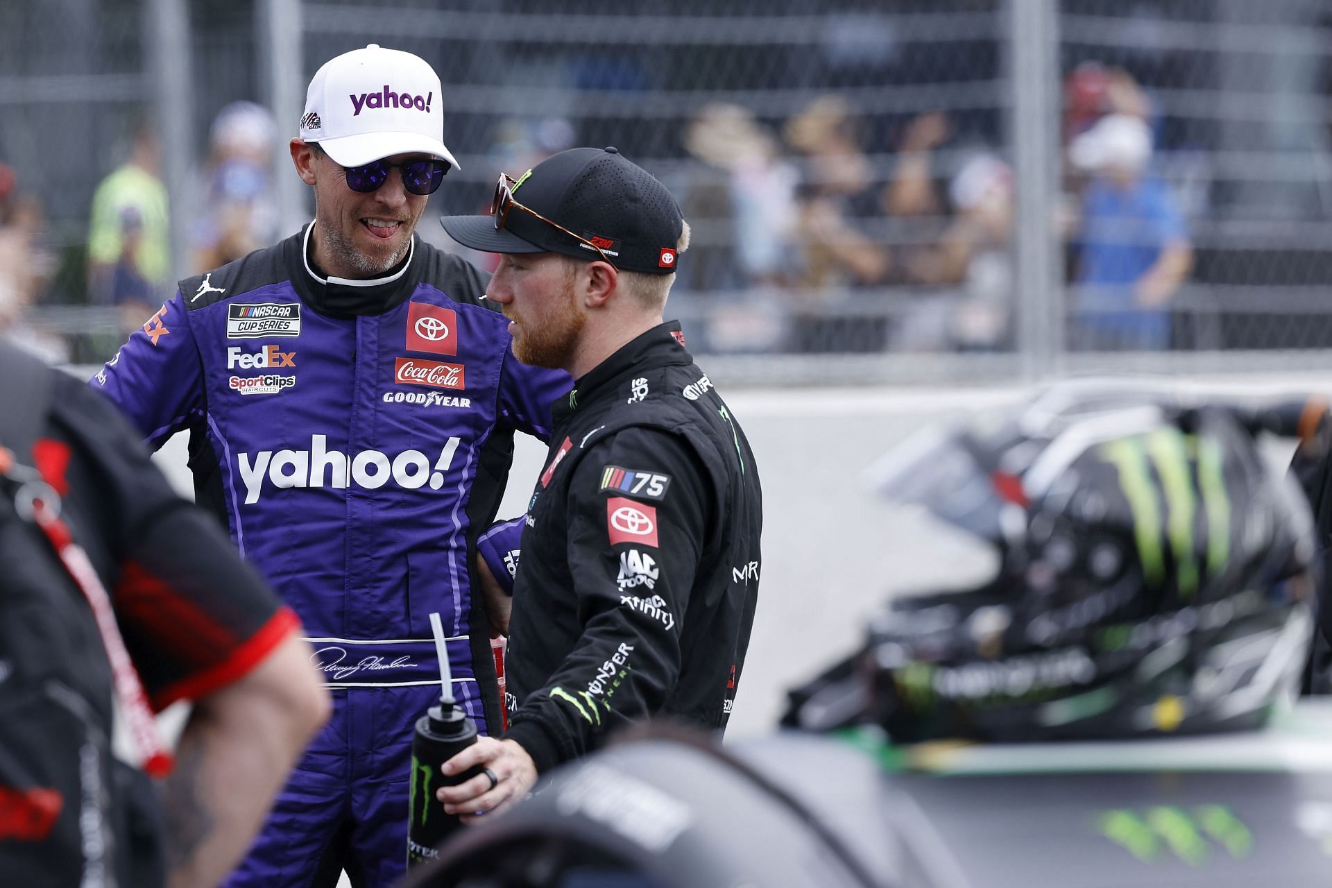 Denny Hamlin (L) talks with Tyler Reddick (R) - Getty Images