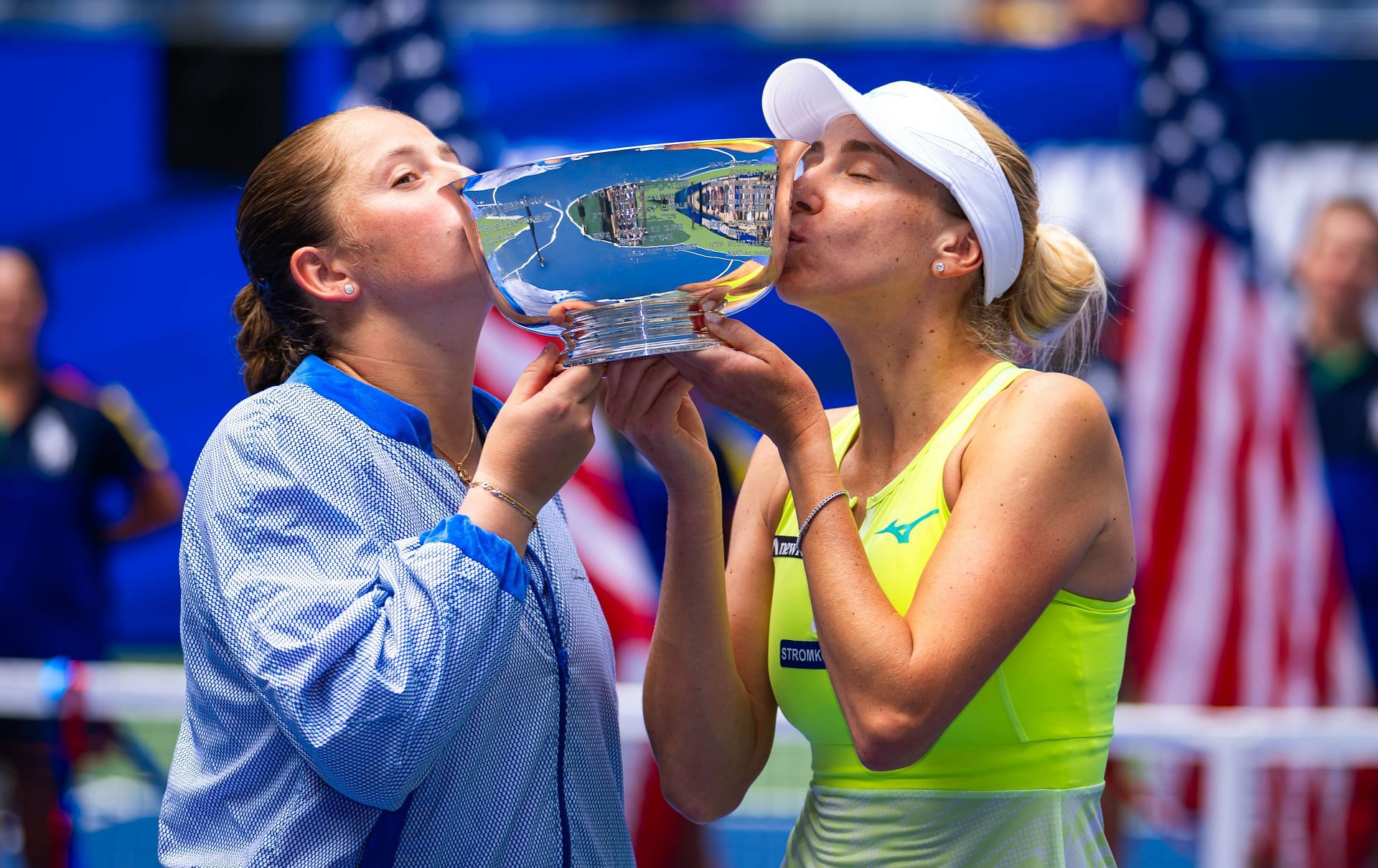 Jelena Ostapenko and Lyudmyla Kicheno with their US Open trophy - Source: Getty