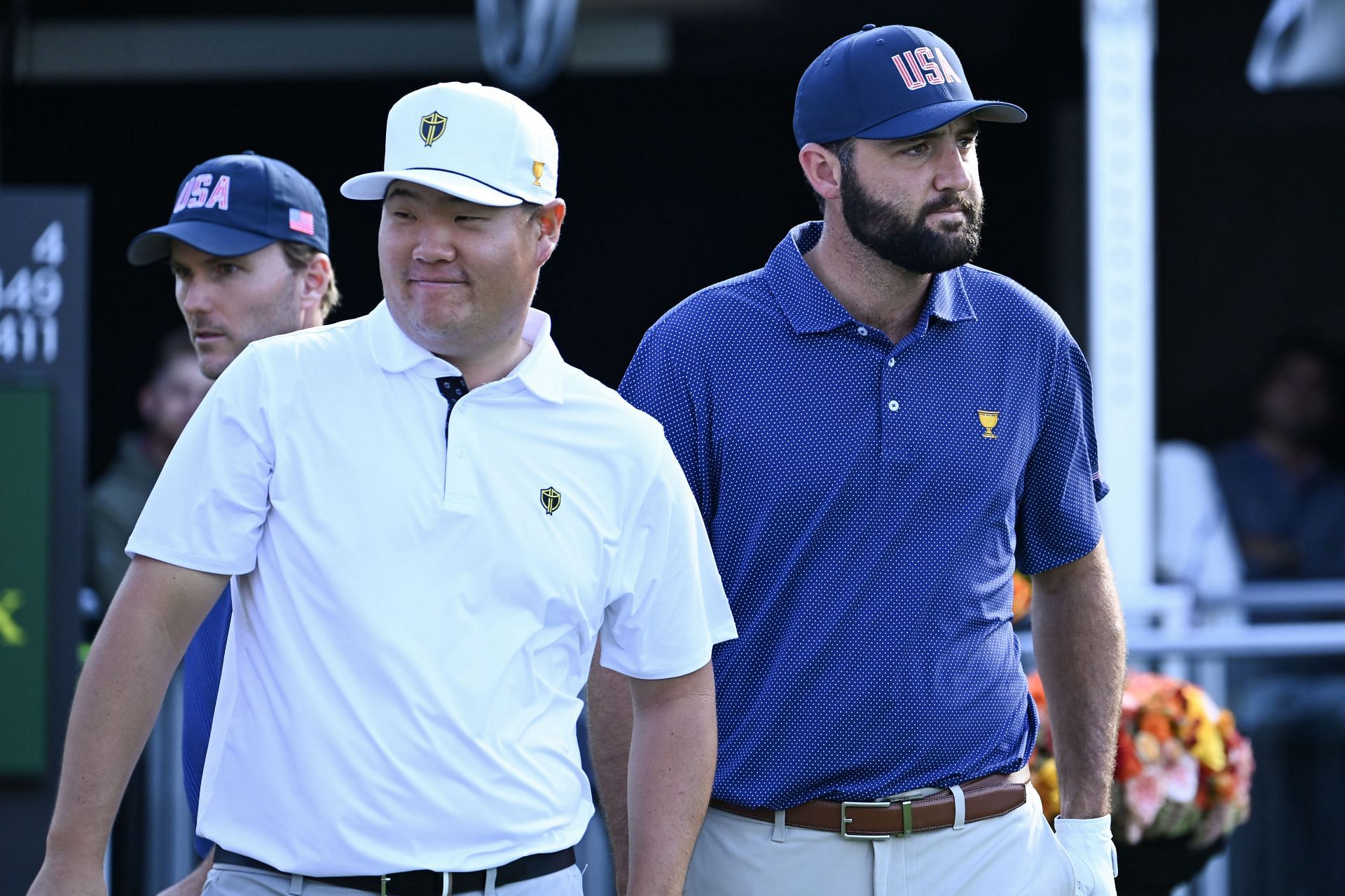 Sungjae Im (International Team) and Scottie Scheffler (US Team) look on while at the first tee during Saturday Foursomes matches on day three of the 2024 Presidents Cup (Image Source: Getty)