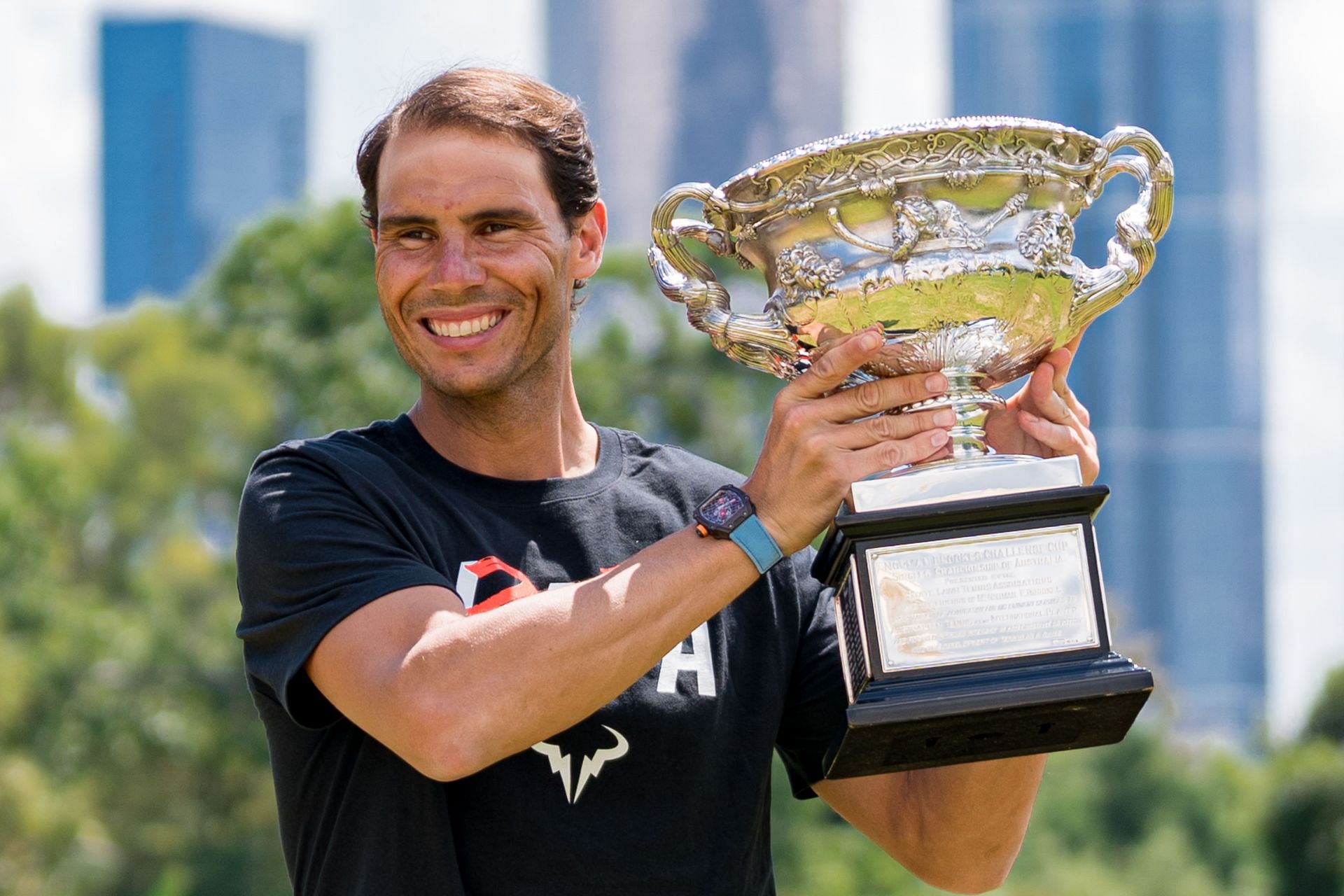 Rafael Nadal poses with the Australian Open trophy in 2022