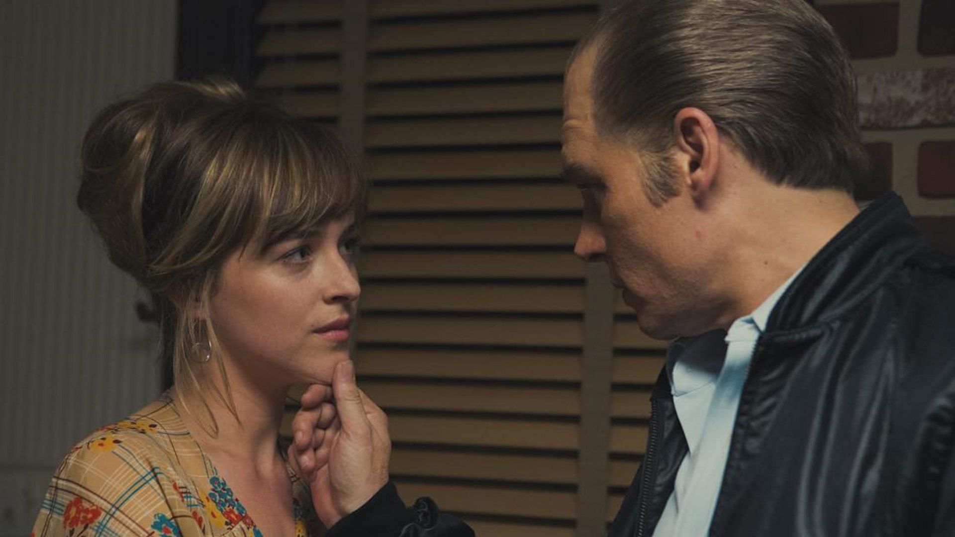 Johnny Depp and Dakota Johnson seen in an image from Black Mass (Image via Instagram/@Blackmassmovie)