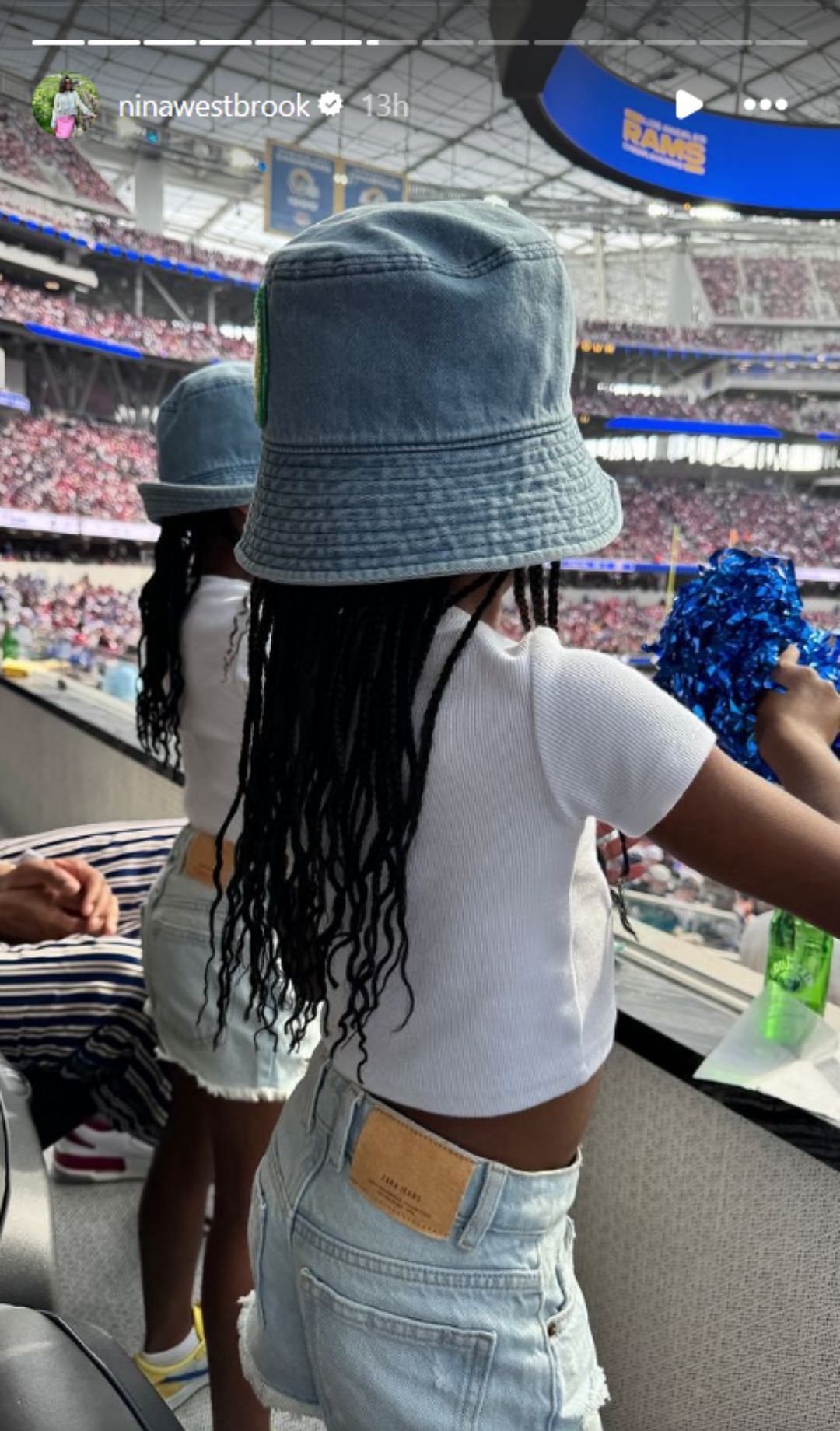 Russell and Nina's twin daughters watching the game (Image: @ninawestbrook IG)