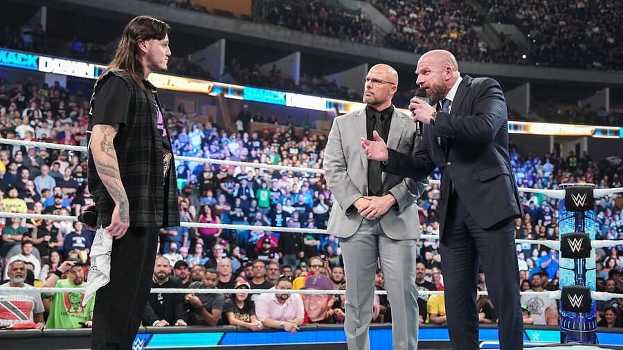 Adam Pearce (right with Triple H) added a stipulation for Dominik Mysterio (left) at Bad Blood (Photo credit: WWE.com)