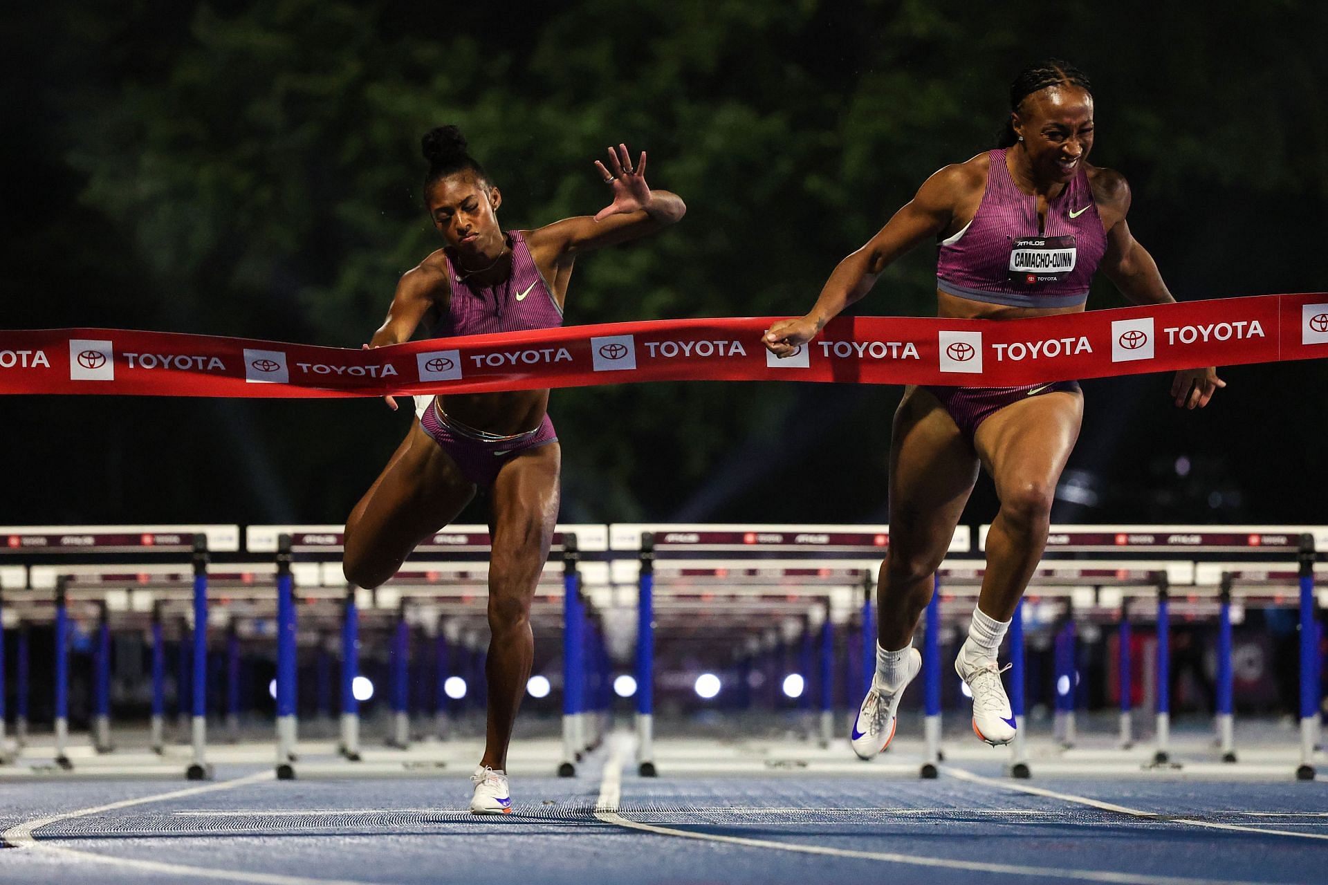 Masai Russell [Left] in action at the Athlos NYC meet [Image Source: Getty]