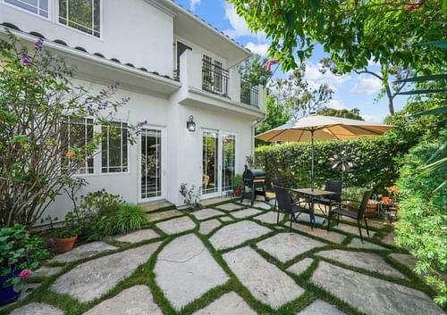 The house showcases a relaxing backyard