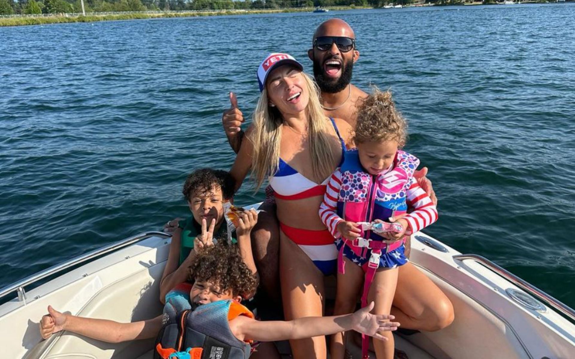 Demetrious Johnson (back) with his wife, Destiny (center) and their children. [Image courtesy: @mighty on Instagram]