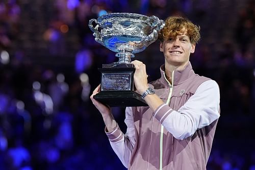 Jannik Sinner posing with the 2024 Australian Open trophy (Source: Getty)