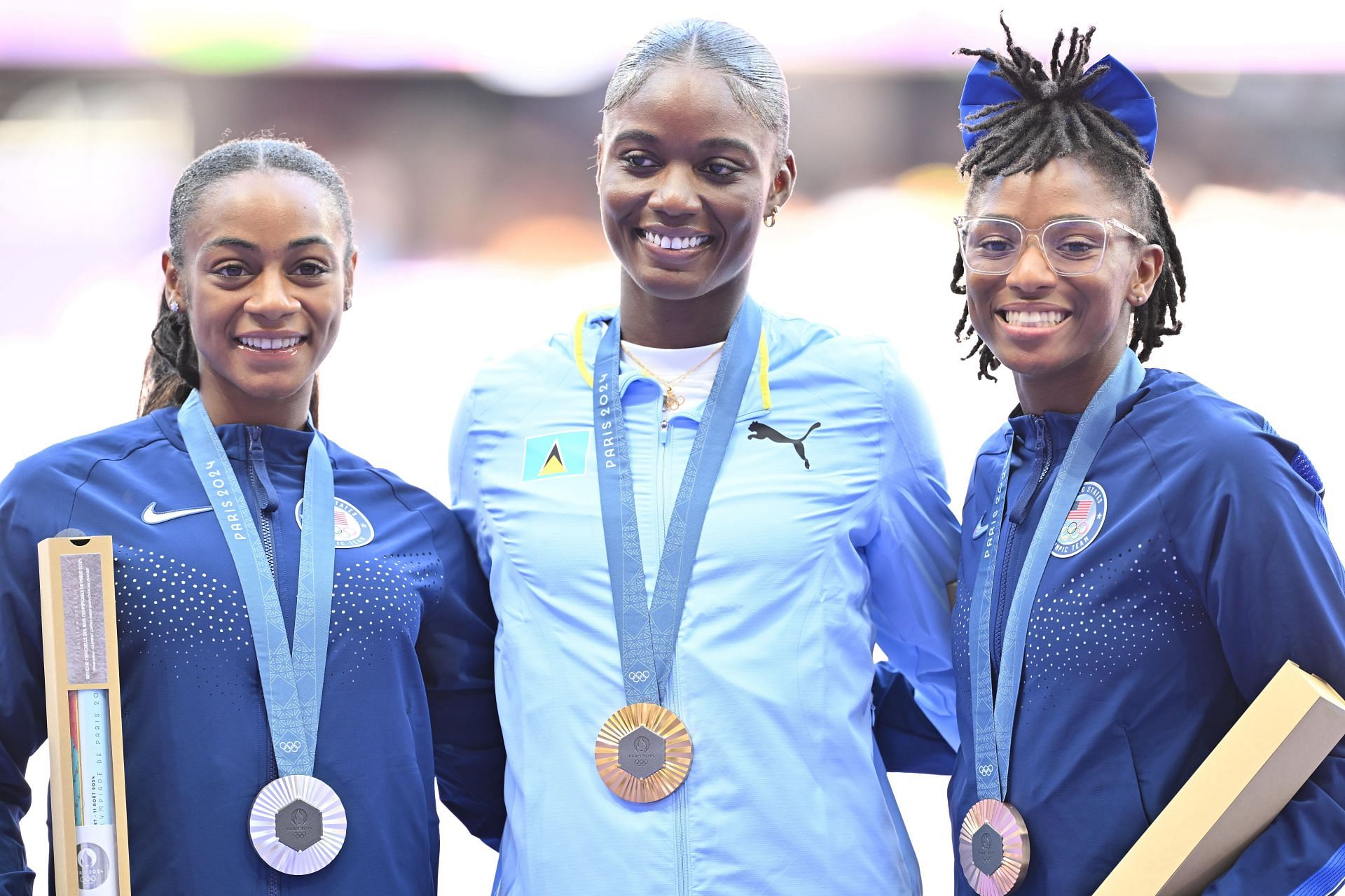 Olympic champion Julien Alfred from Saint Lucia alongside silver medalist Sha&#039;Carri Richardson and bronze medalist Melissa Jefferson of the USA at the Paris Olympics 2024 [Image Source: Getty]