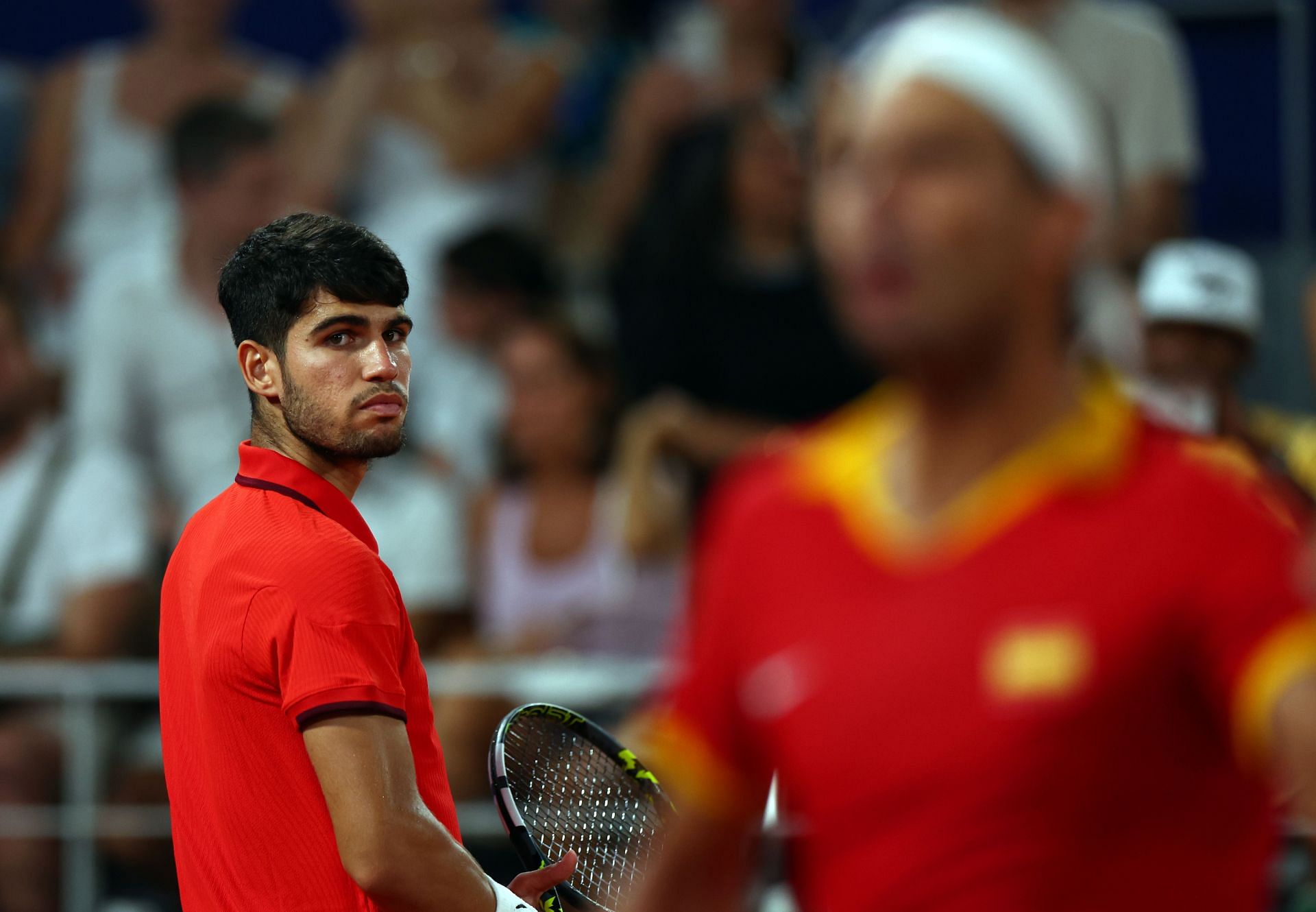 Carlos Alcaraz watches Rafael Nadal on (Source: Getty)