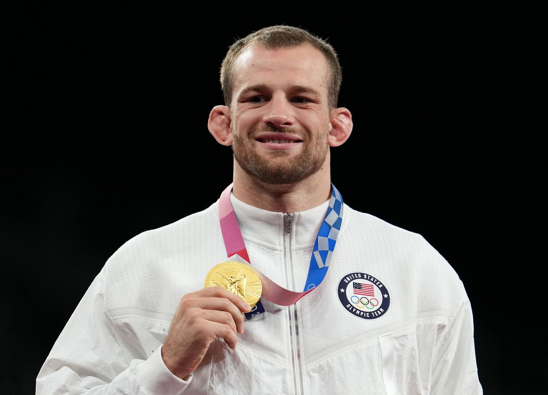 David Taylor posing with his Olympic gold medal at the Tokyo 2020 Olympic Games - Source: Getty