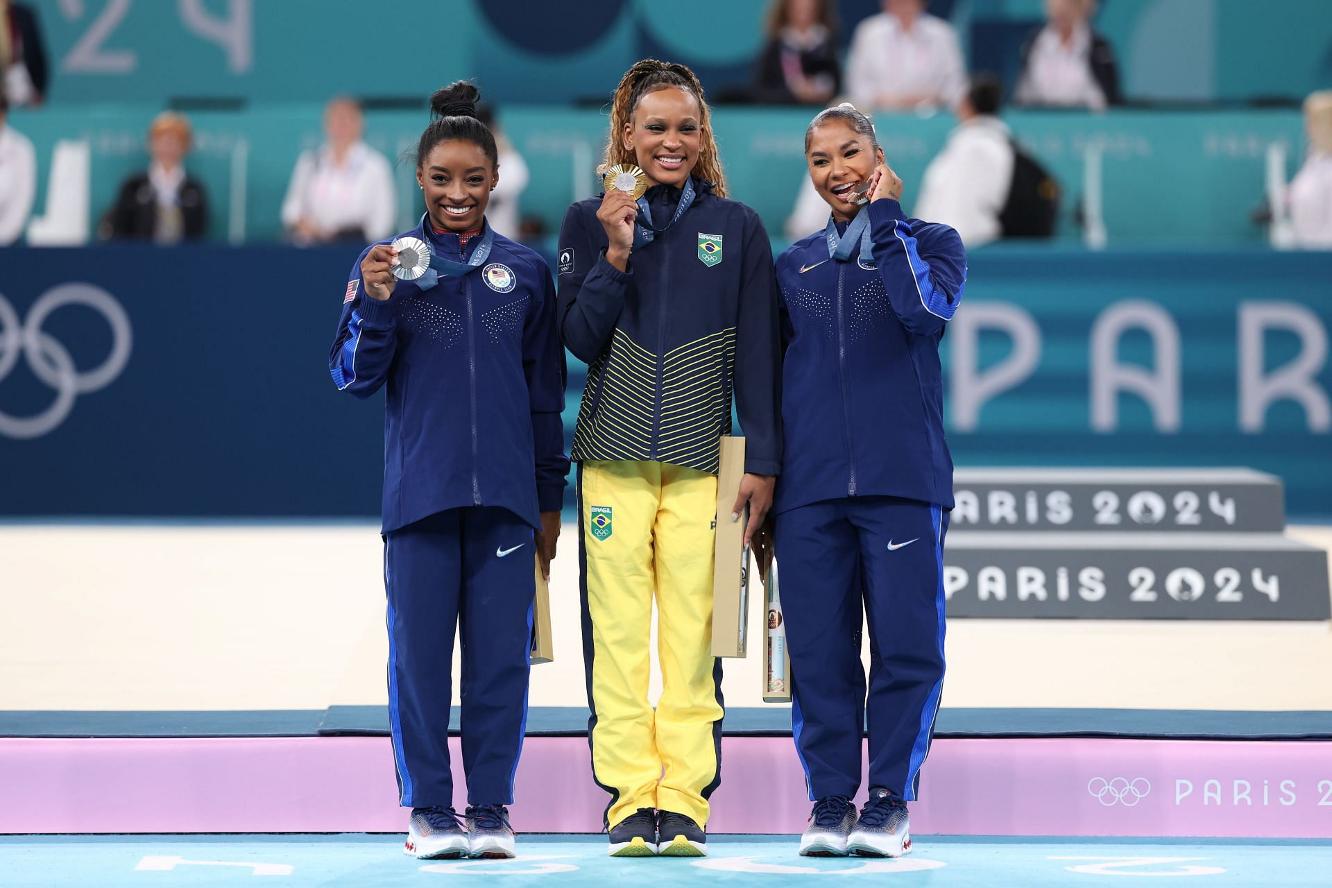 Jordan Chiles with gold medalist Rebeca Andrade and silver medalist Simone Biles after the floor exercise finals at the Paris Olympics 2024 [Image Source: Getty]