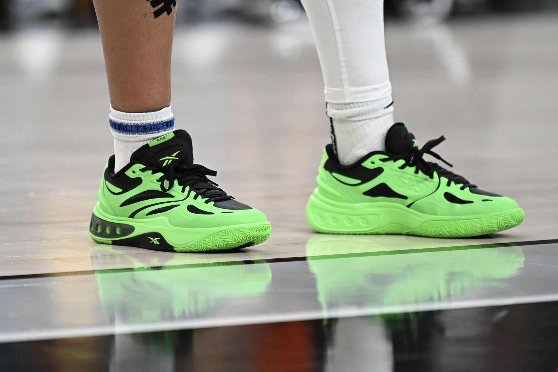 Reese wears the lime green colorway of the &quot;Engine A&quot; sneakers. (Source: Getty)