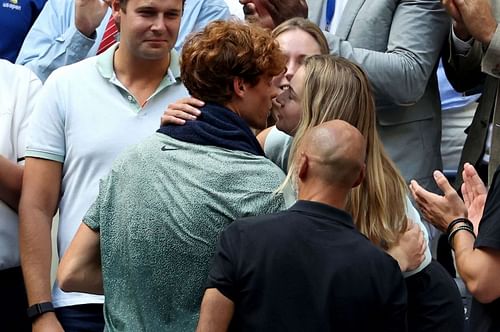 Jannik Sinner and girlfriend Anna Kalinskaya share a kiss after his US Open 2024 victory - Image Source: Getty