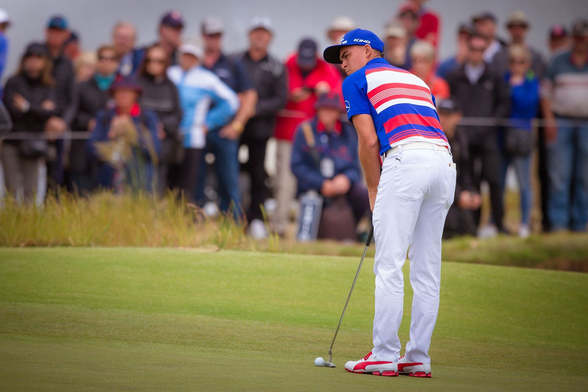 Rickie Fowler of the USA takes his putt on the 18th green of the Kingston Heath Golf Club [Image via Getty]