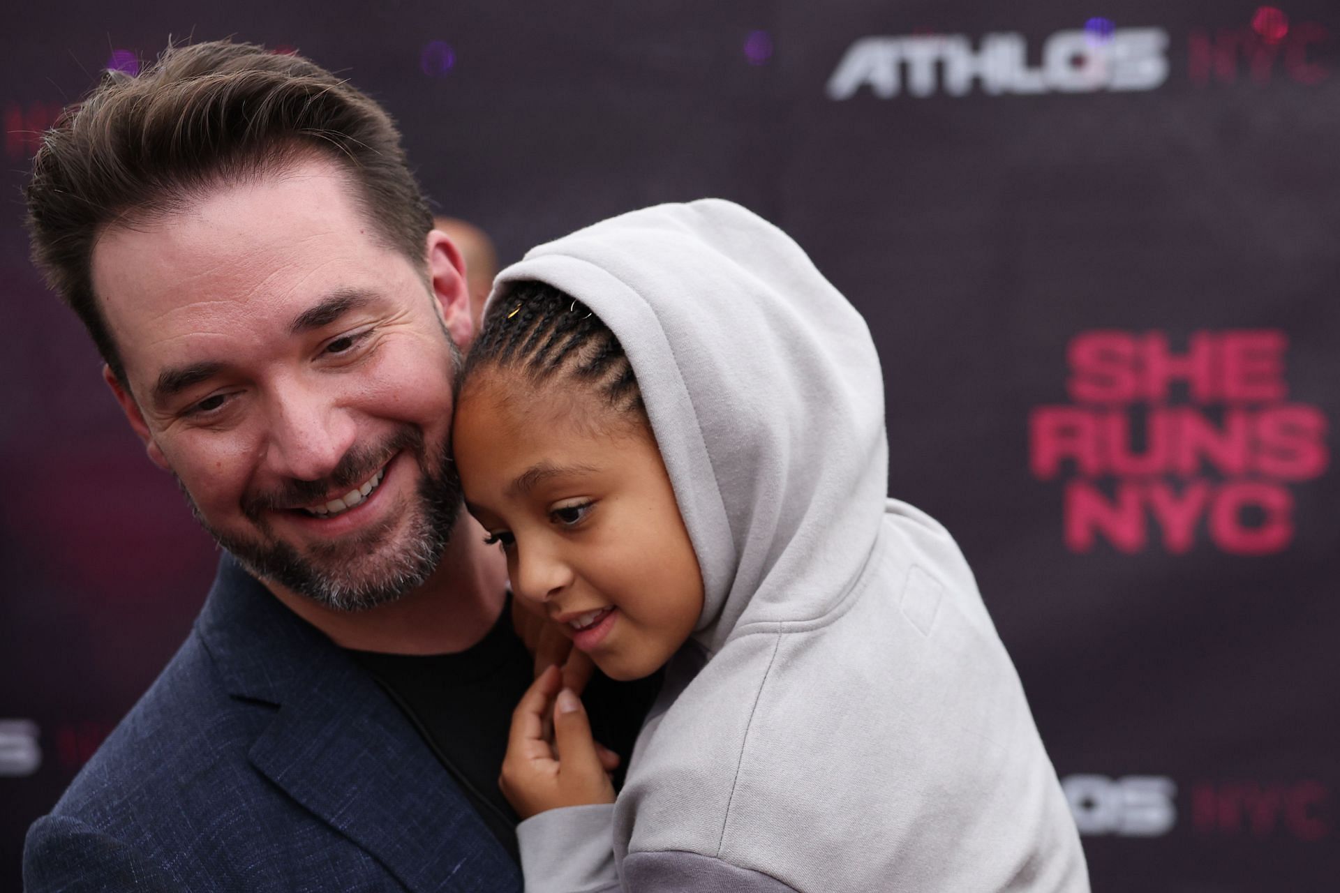 Alexis Ohanian and his daughter arrive before the Athlos NYC at Icahn Stadium in New York City. (Photo by Getty Images)