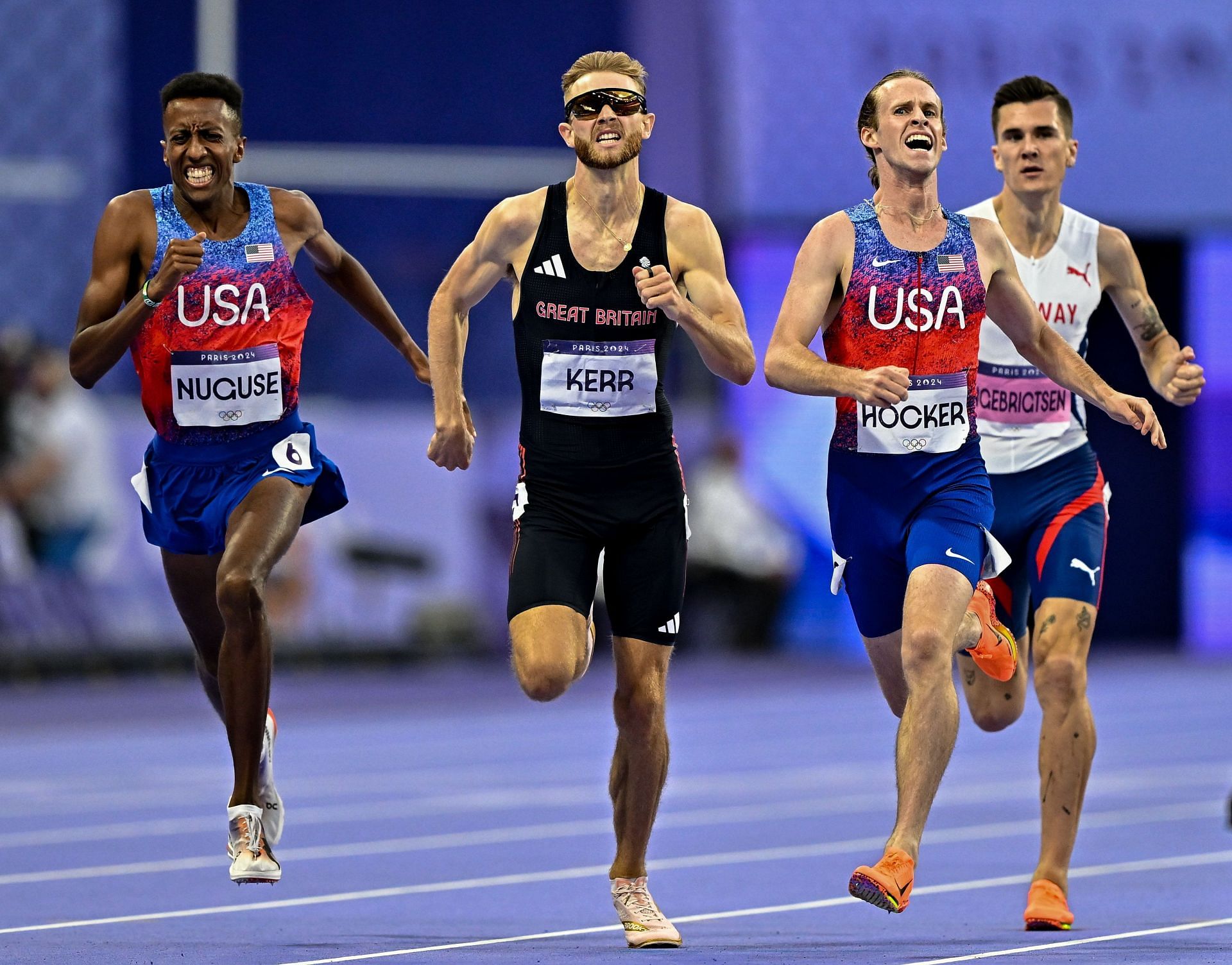 Cole Hocker crosses the finish line ahead of Josh Kerr and Yared Nuguse in 1500m at Paris Olympics. (Photo By Sam Barnes/Sportsfile via Getty Images)