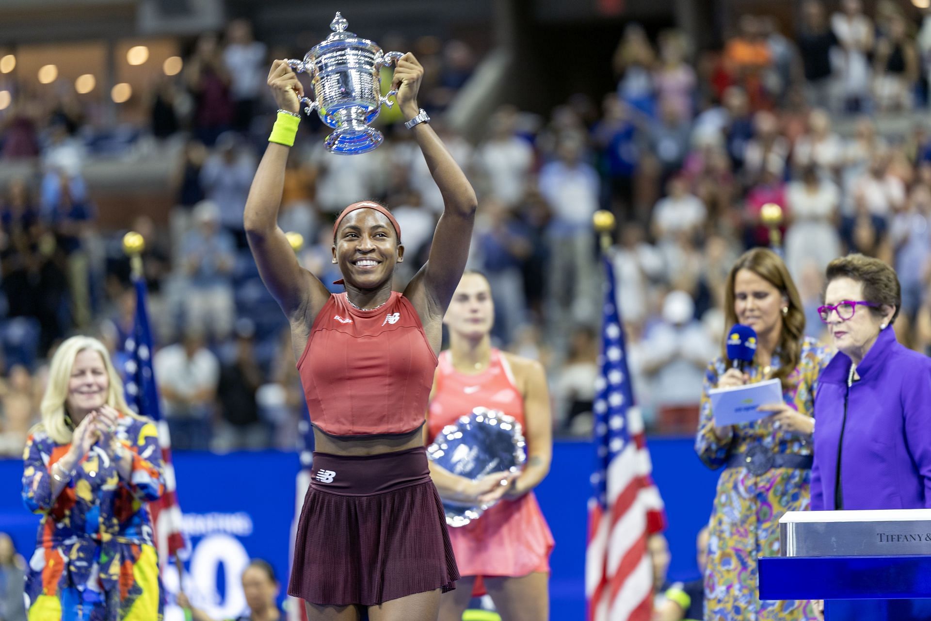 Coco Gauff lifting her trophy at the US Open Tennis Championship 2023 - Source: Getty