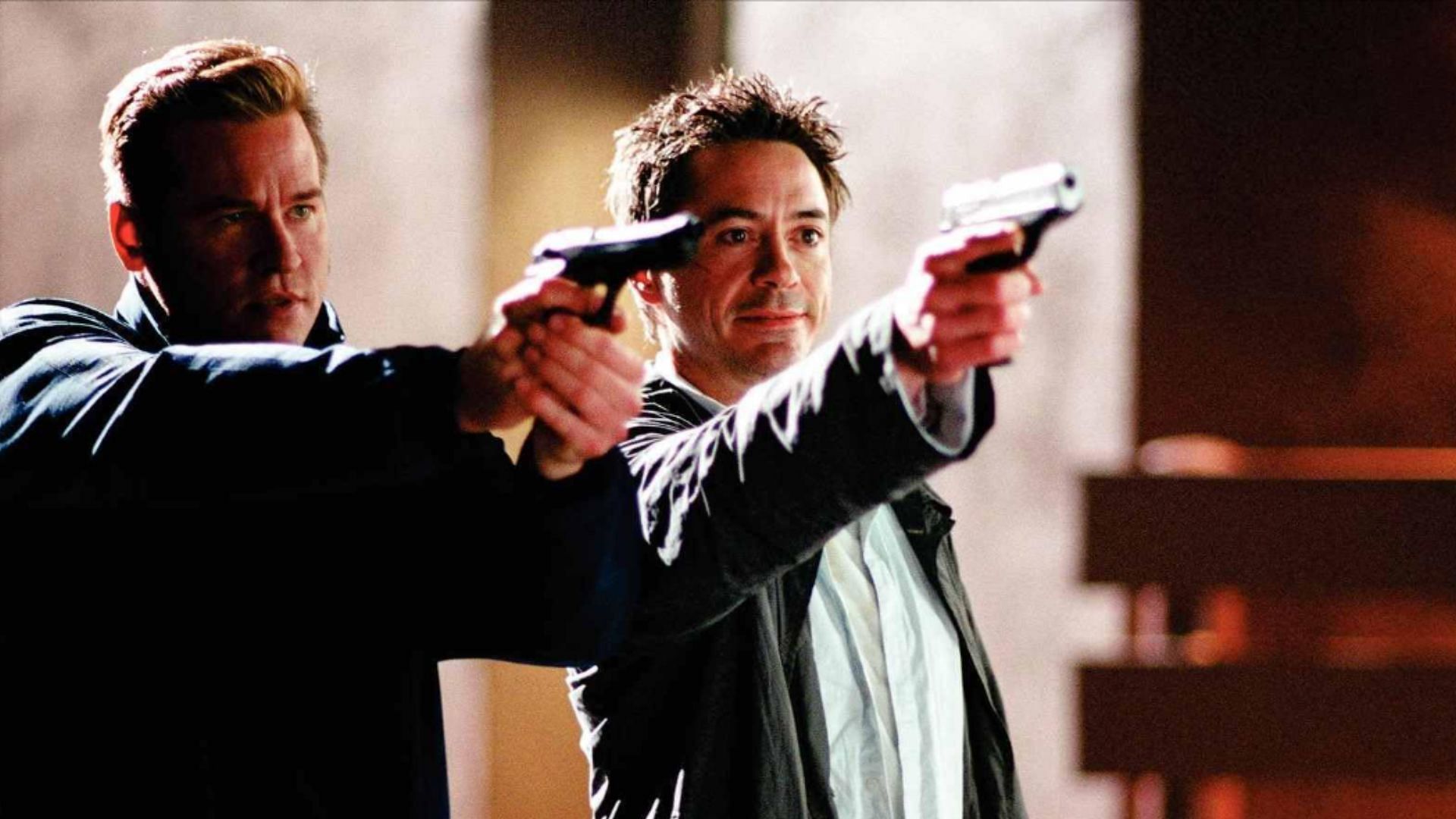 Val Kilmer and Robert Downey Jr. in Kiss Kiss Bang Bang (2005) (image via Warner Bros.)