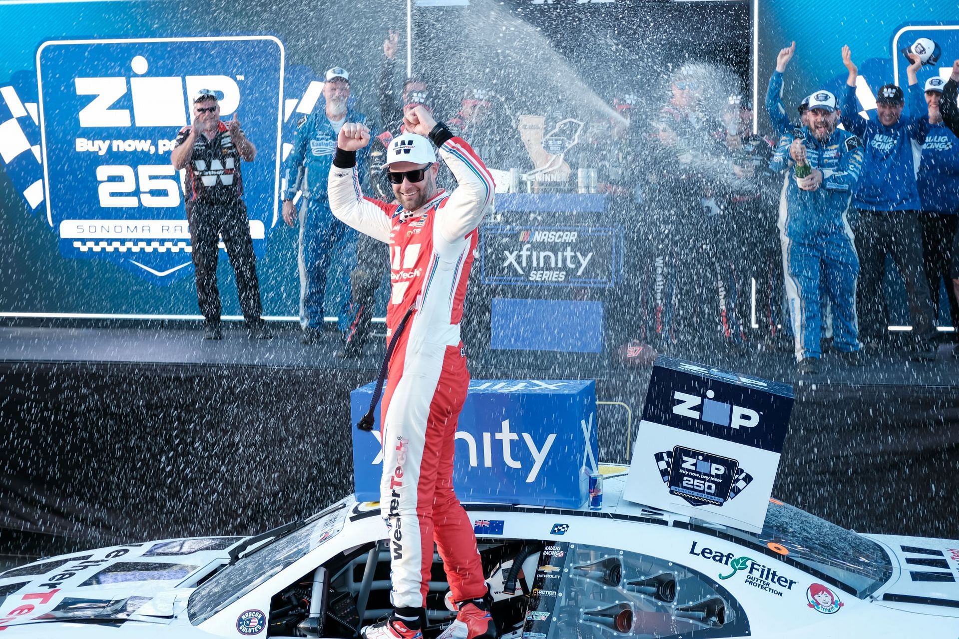 Shane van Gisbergen celebrates his win at the NASCAR Xfinity Series Zip Bow Pay Later 250 race at Sonoma Raceway in June (Source: Getty)