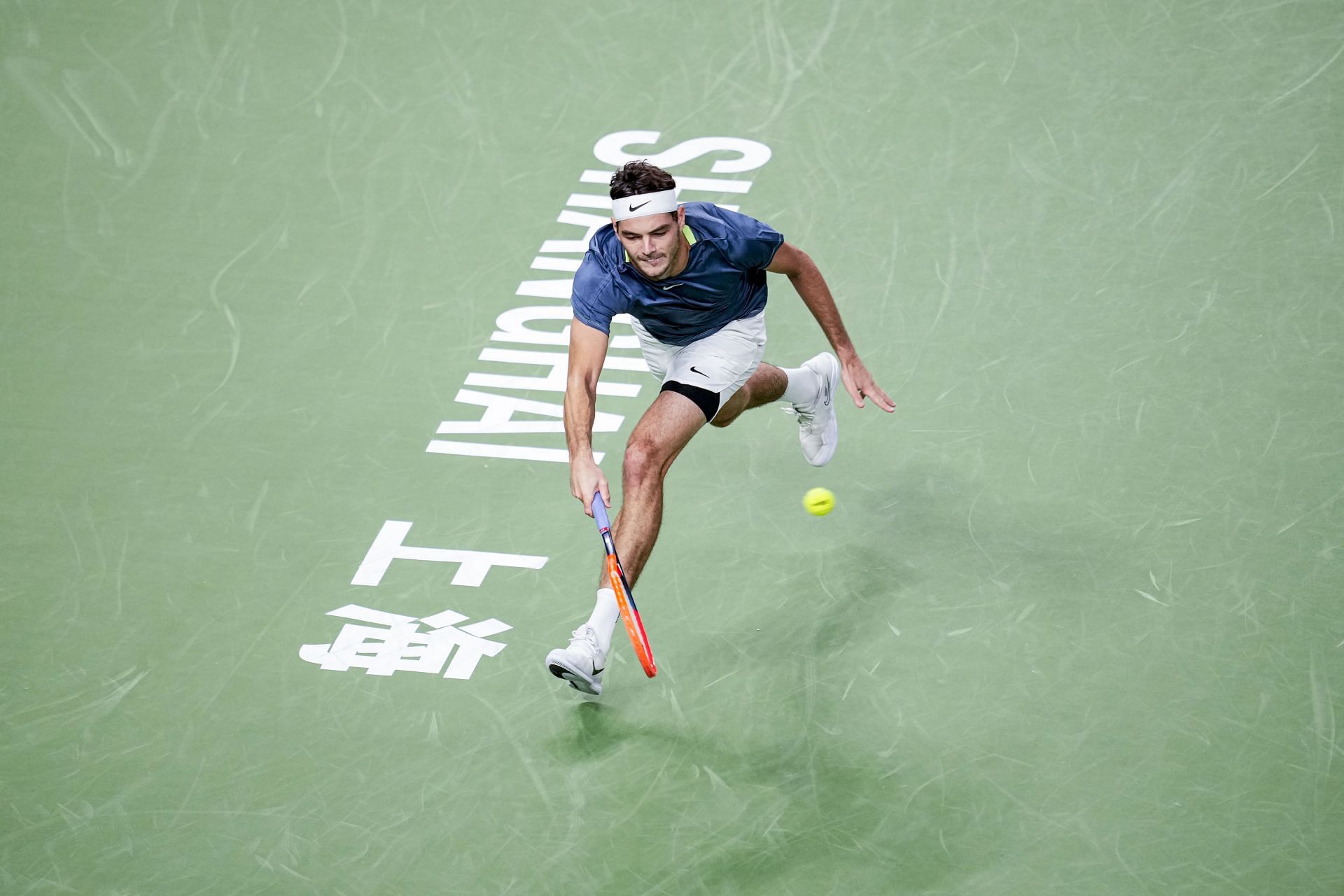 Taylor Fritz streches to make a forehand in the Shanghai Rolex Masters - Source: Getty