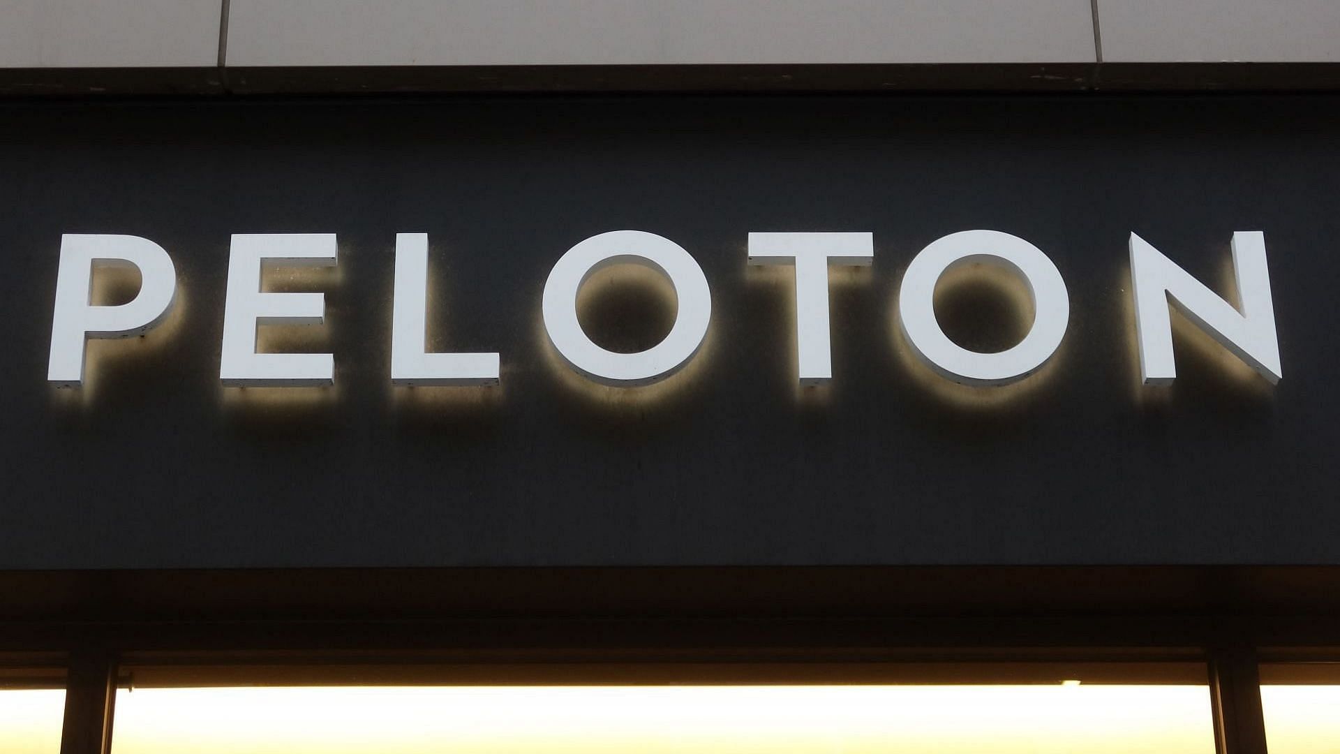 A Peloton corporate logo hangs on the front of their store in Santa Monica on April 10, 2023, in Los Angeles, California (Image via Getty/Gary Hershorn)