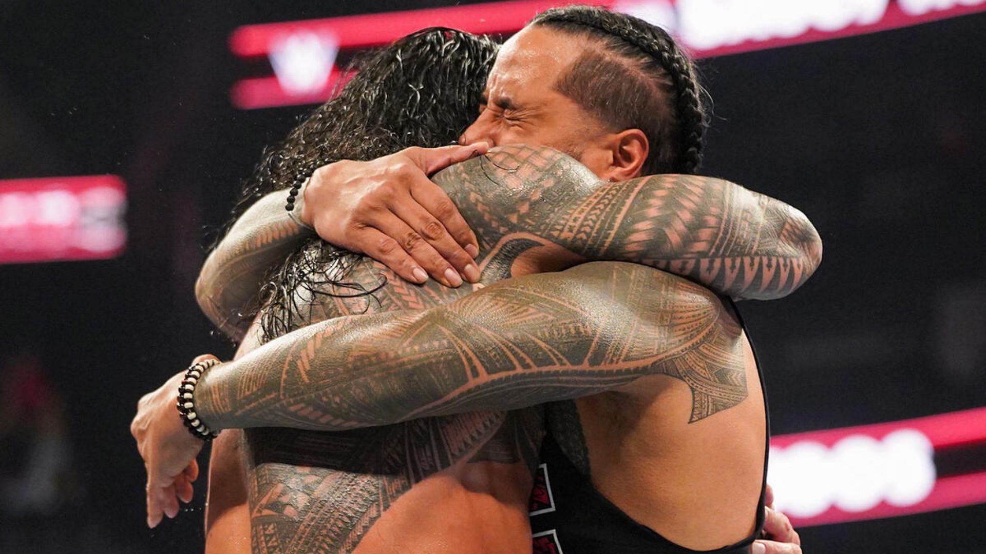 Roman Reigns and Jimmy Uso shared an emotional hug at Bad Blood.[Image via WWE.com]