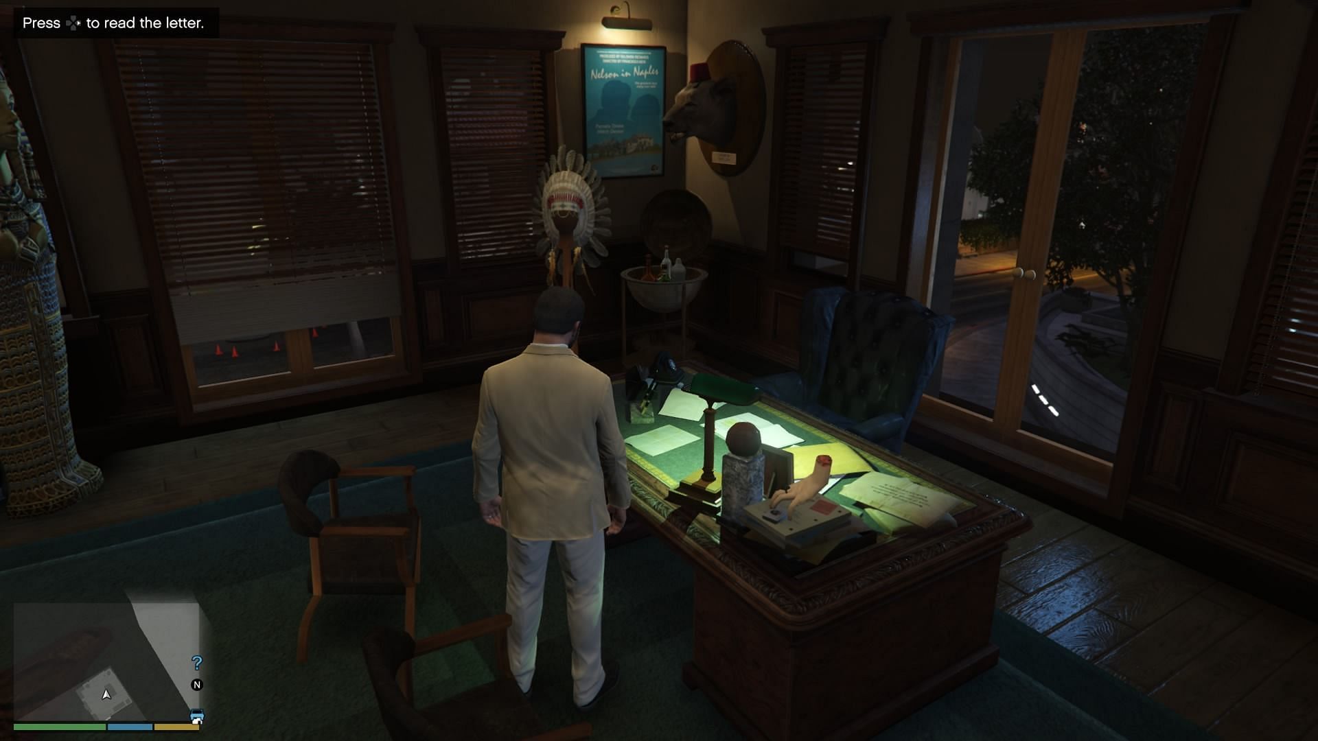 Approach the desk and press the prompted button to read the letter (Image via Rockstar Games)