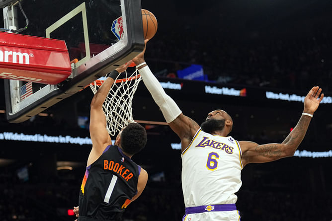 Watch: Year 22 LeBron James sends Devin Booker's layup attempt 3 rows back with incredible chase down block
