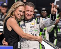 AJ Allmendinger's wife Tara turns heads with her chic black outfit as she poses with husband and son Aero at Homestead-Miami Speedway