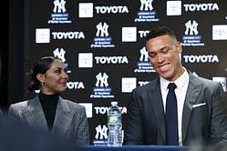 Aaron Judge's wife Samantha cradles her dog while posing with Yankees wives before flying out to support team at World Series