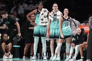 New York Liberty's Jonquel Jones, Breanna Stewart and Sabrina Ionescu watch the game against the Las Vegas Aces at Barclays Center. Photo Credit: Imagn
