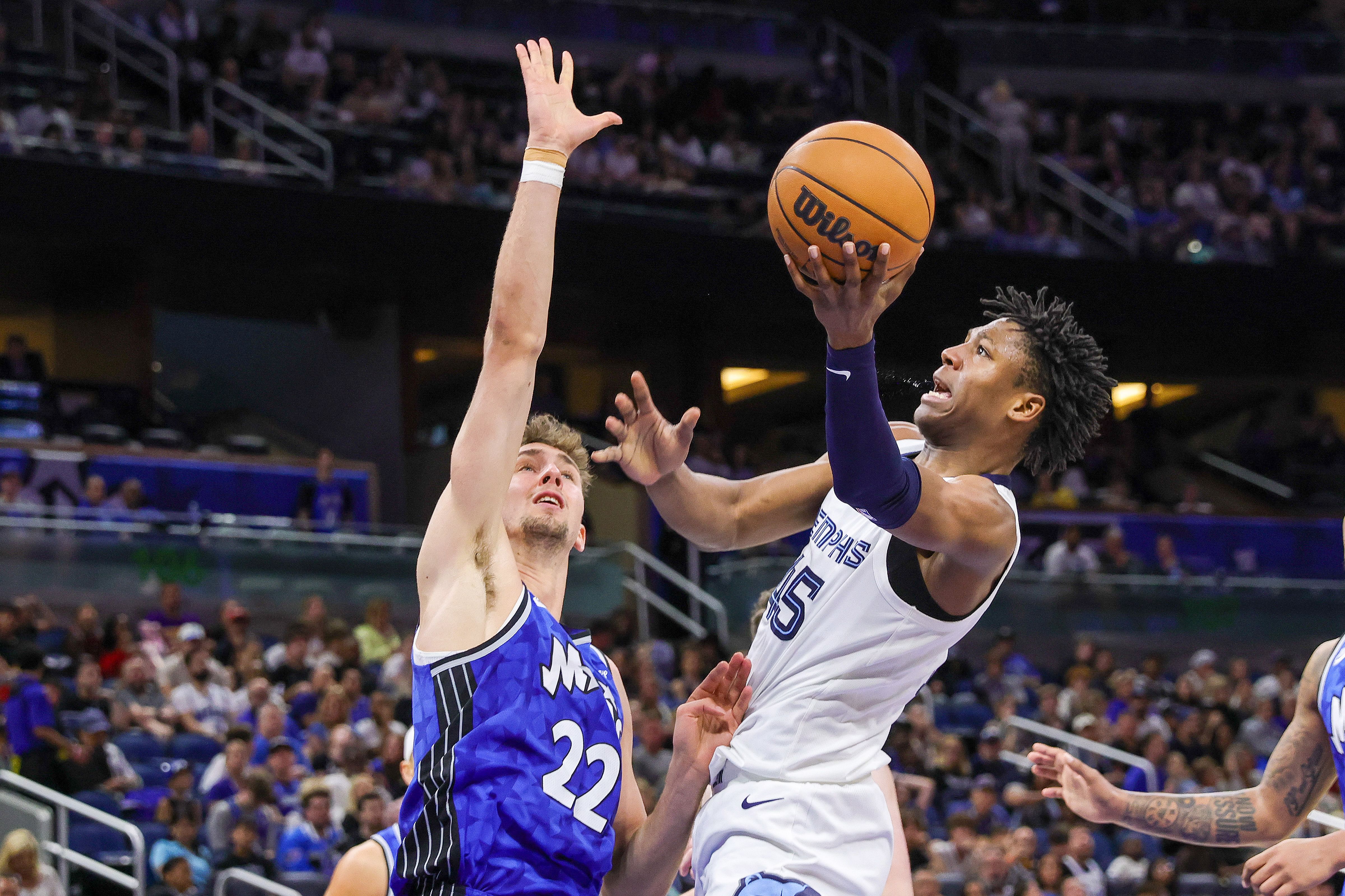 Memphis Grizzlies forward GG Jackson drives to the basket against Orlando Magic forward Franz Wagner at KIA Center. Photo Credit: Imagn