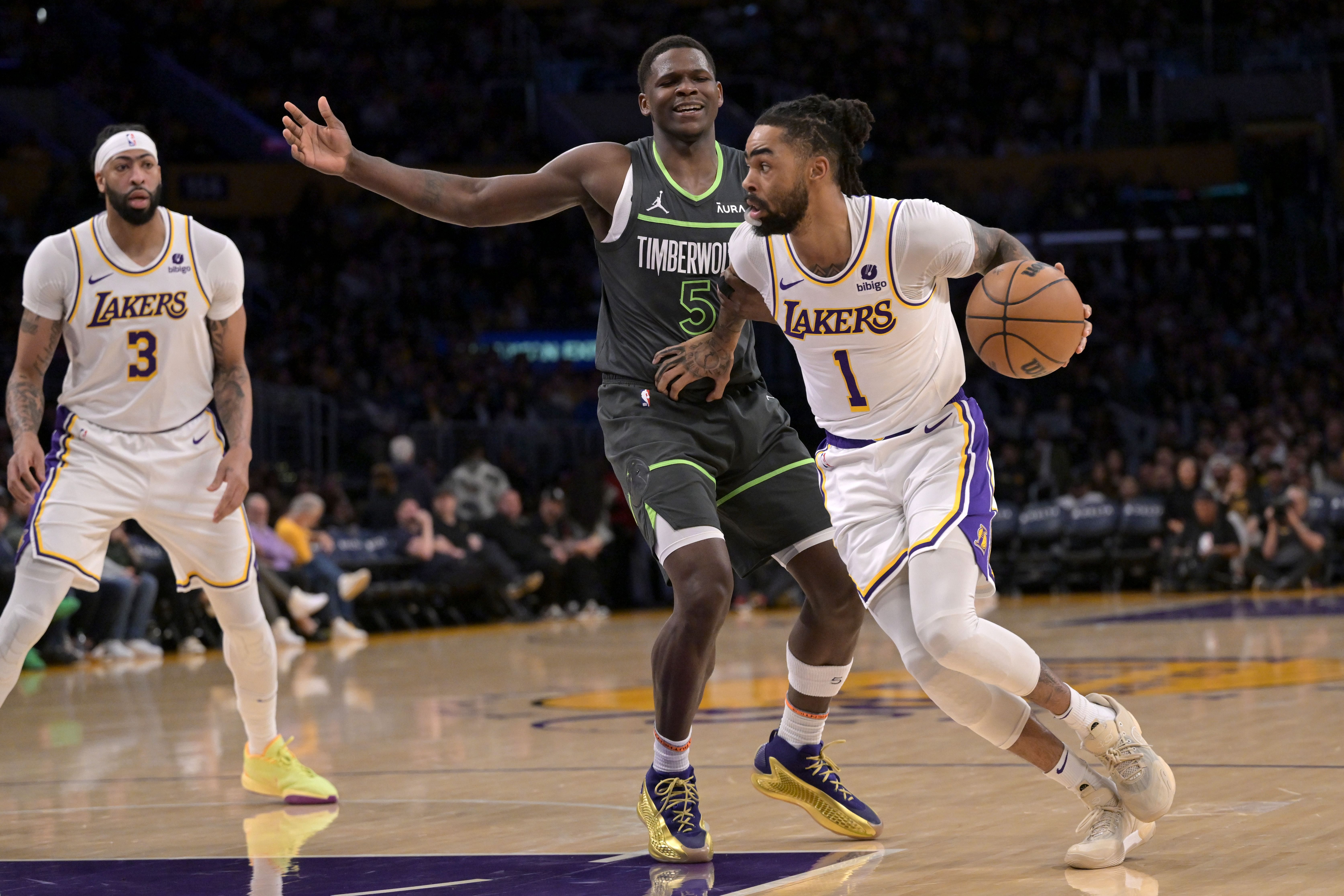 Los Angeles Lakers guard D&#039;Angelo Russell is defended by Minnesota Timberwolves guard Anthony Edwards at Crypto.com Arena. Photo Credit: Imagn