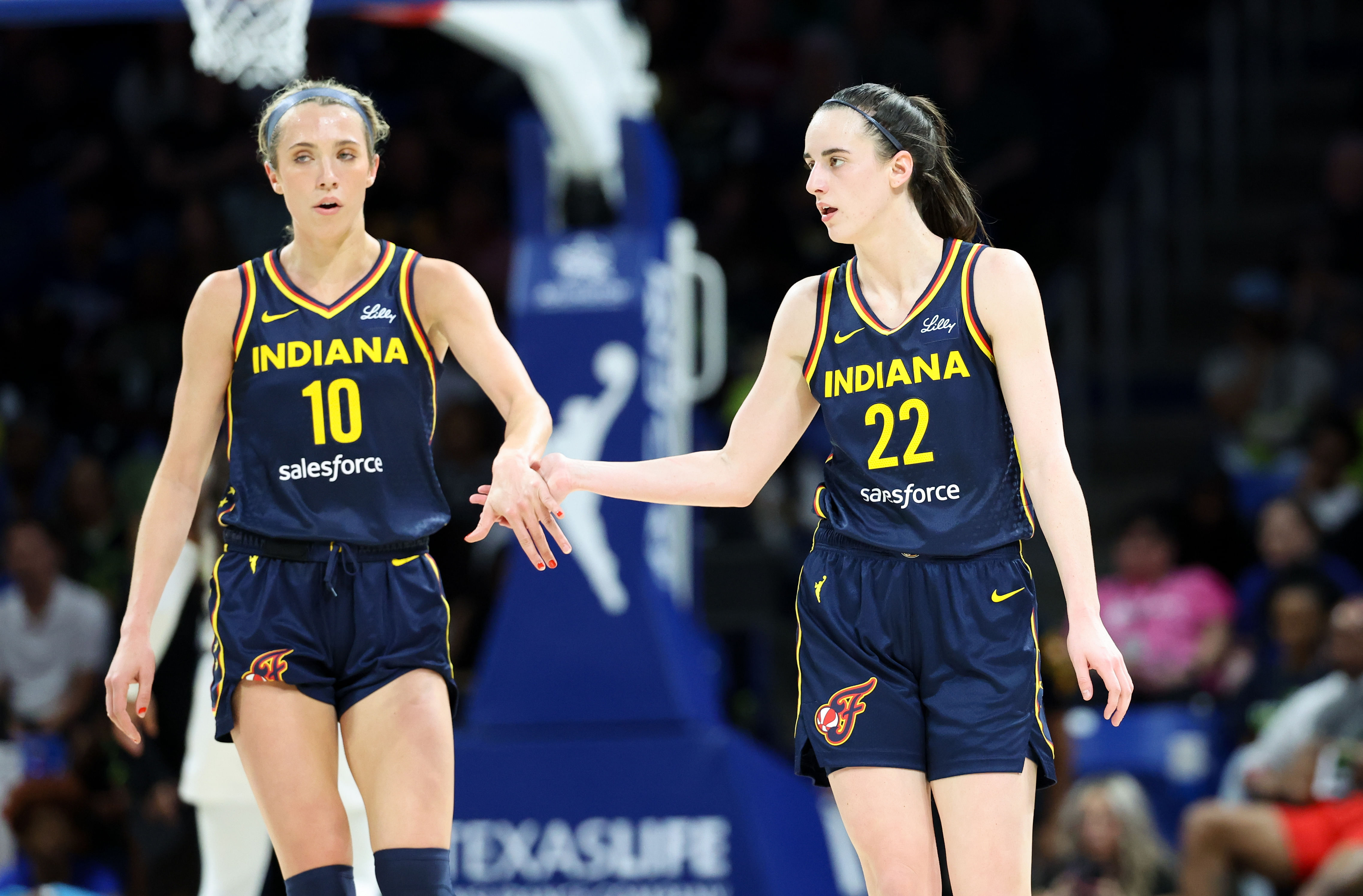 Indiana Fever guard Caitlin Clark celebrates with Lexie Hull during the second quarter at College Park Center. Photo Credit: Imagn