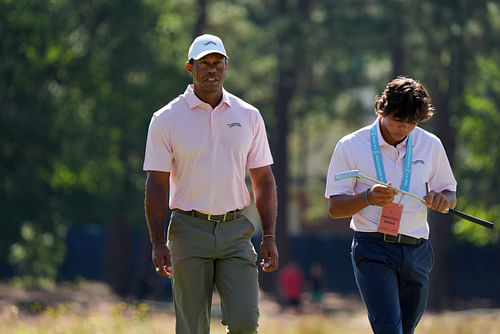 Tiger Woods and his son work together at golf (Imagn)