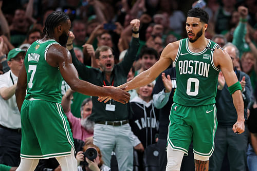 Boston Celtics forward Jayson Tatum celebrates with guard Jaylen Brown at TD Garden. Photo Credit: Imagn