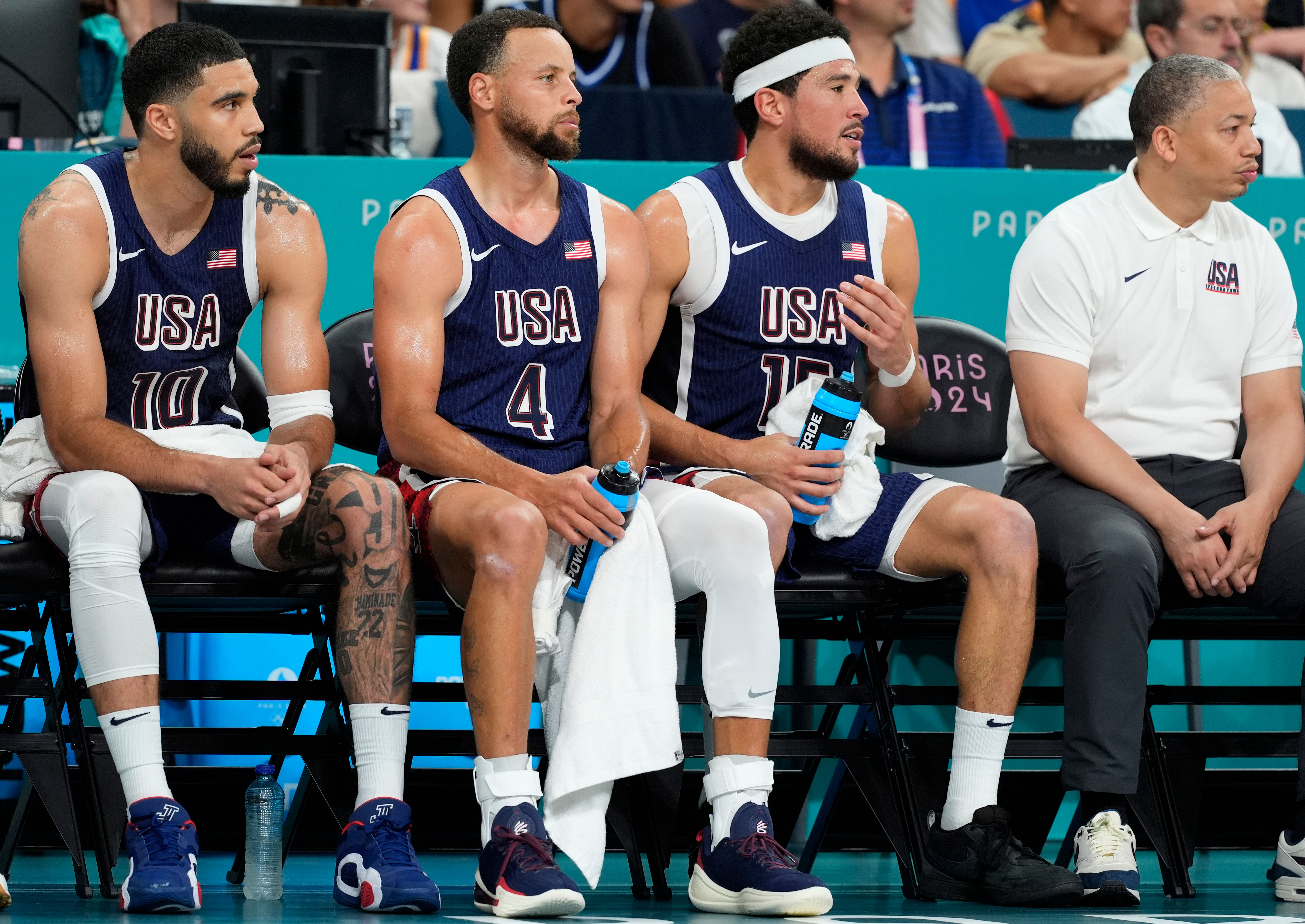 United States guards Jayson Tatum, Stephen Curry, Devin Booker and assistant coach Tyronn Lue during the Paris 2024 Olympic Summer Games. Photo Credit: Imagn