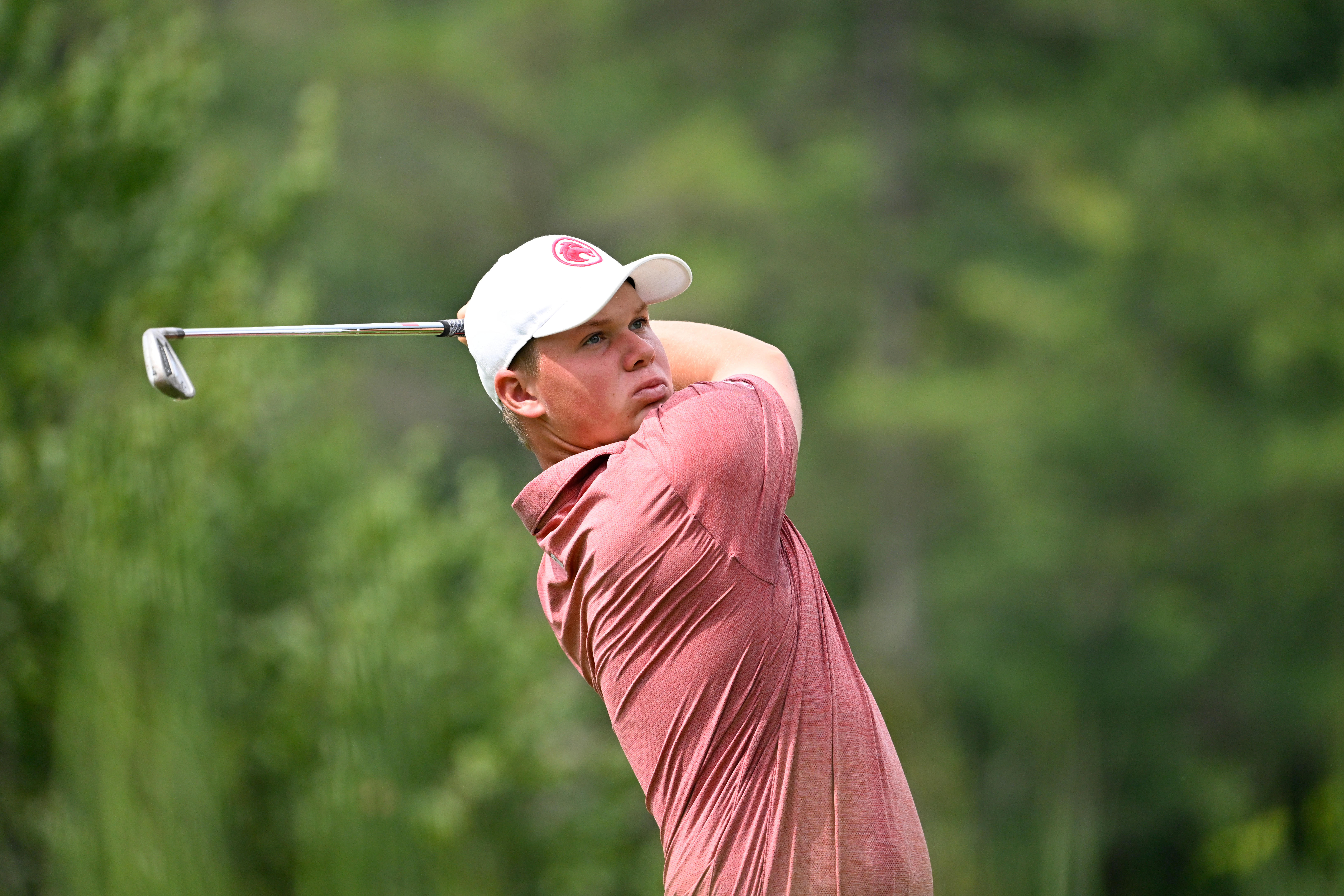 Caleb Surratt watches his shot during LIV Golf Greenbrier (Image Source: Imagn)