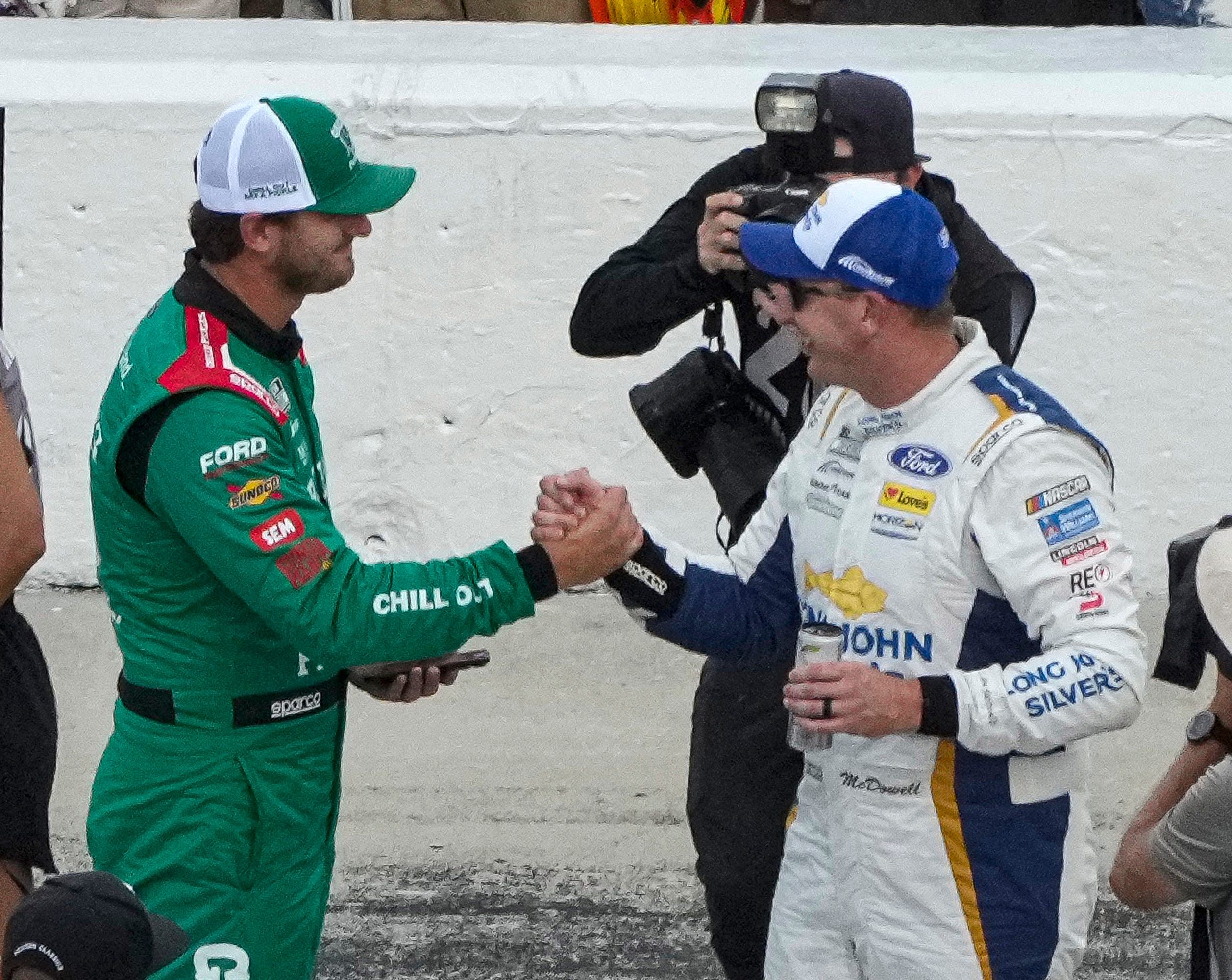 Michael McDowell and Todd Gilliland congratulate each other after wining the pole and outside pole (respectively) for the running of the Coke Zero 400 at Daytona International Speedway (Imagn: Getty)