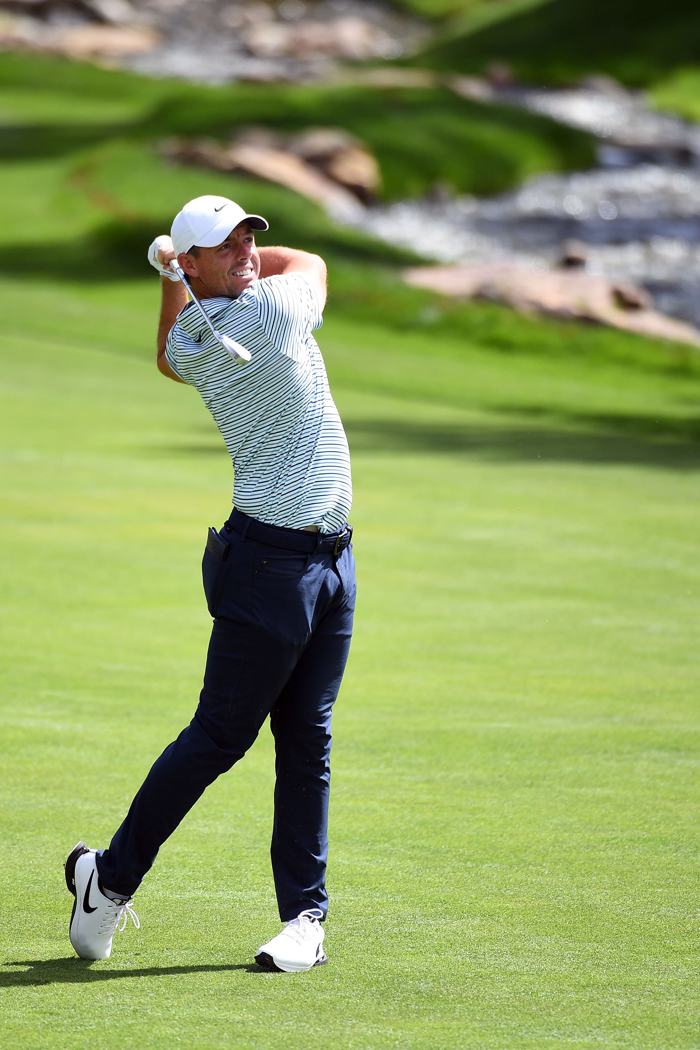 Aug 25, 2024; Castle Rock, Colorado, USA; Rory McIlroy hits his second shot on the 17th hole during the final round of the BMW Championship golf tournament at Castle Pines Golf Club. Mandatory Credit: Christopher Hanewinckel-Imagn Images