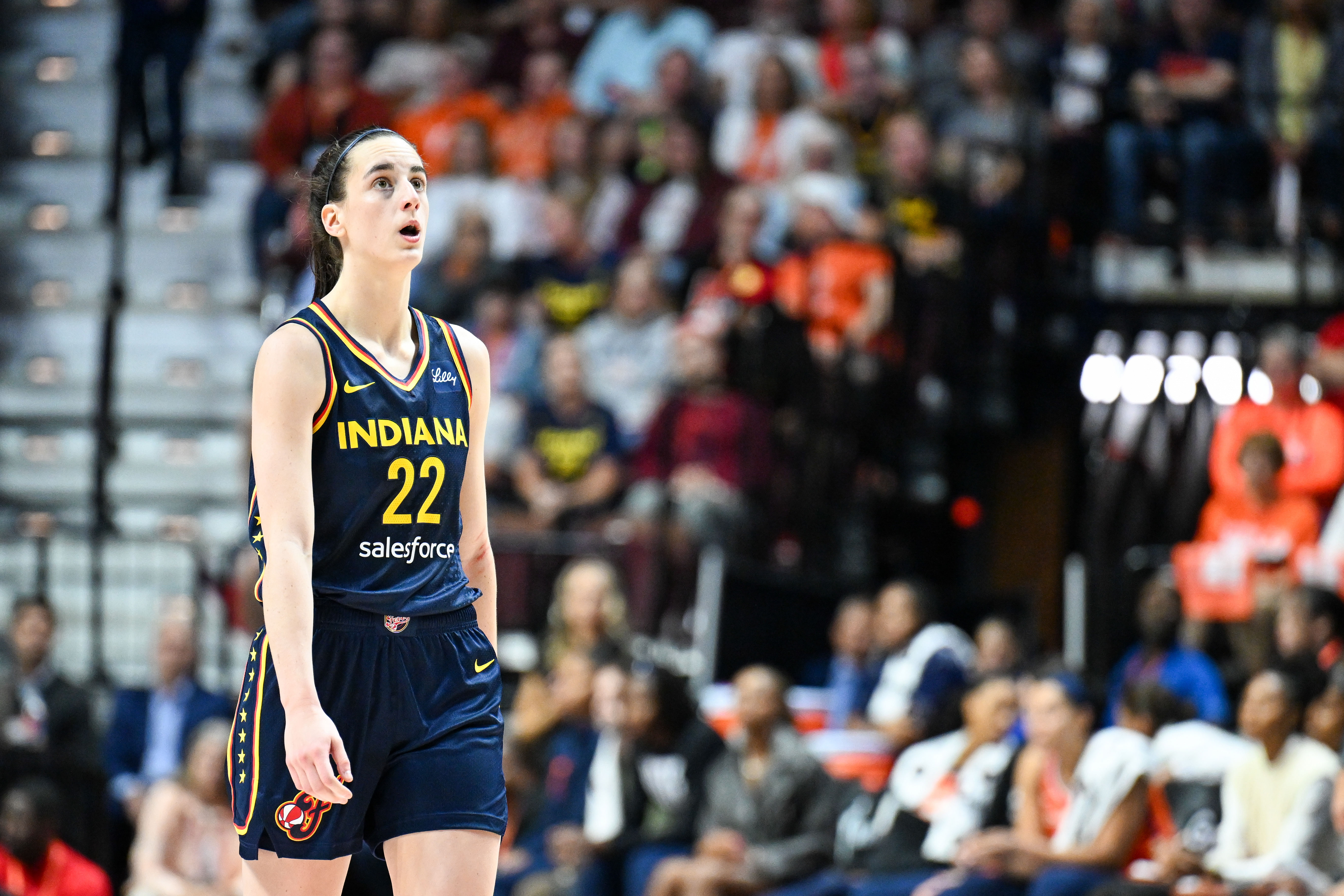 Caitlin Clark looks at the video board against Connecticut Sun during a game at Mohegan Sun Arena. Photo Credit: Imagn