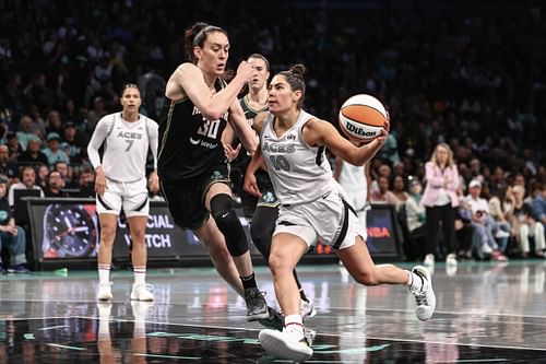 Las Vegas Aces guard Kelsey Plum drives past New York Liberty forward Breanna Stewart at Barclays Center. Photo Credit: Imagn