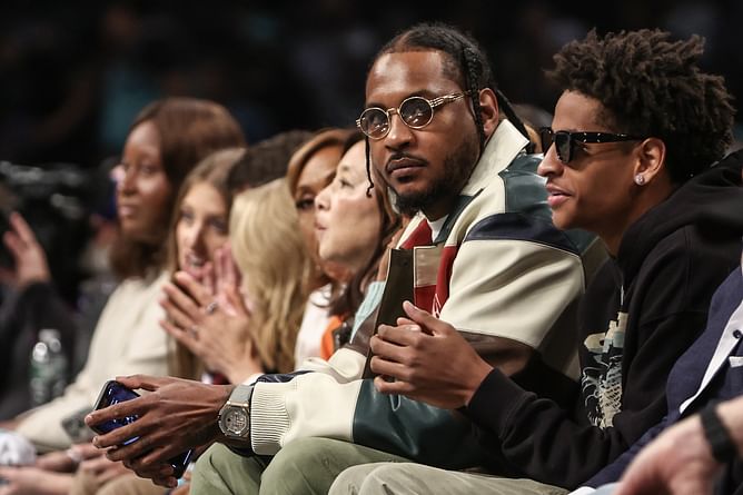 Watch: Carmelo Anthony rocks Knicks themed bomber jacket and gets rousing ovation from MSG as son Kiyan Anthony looks on