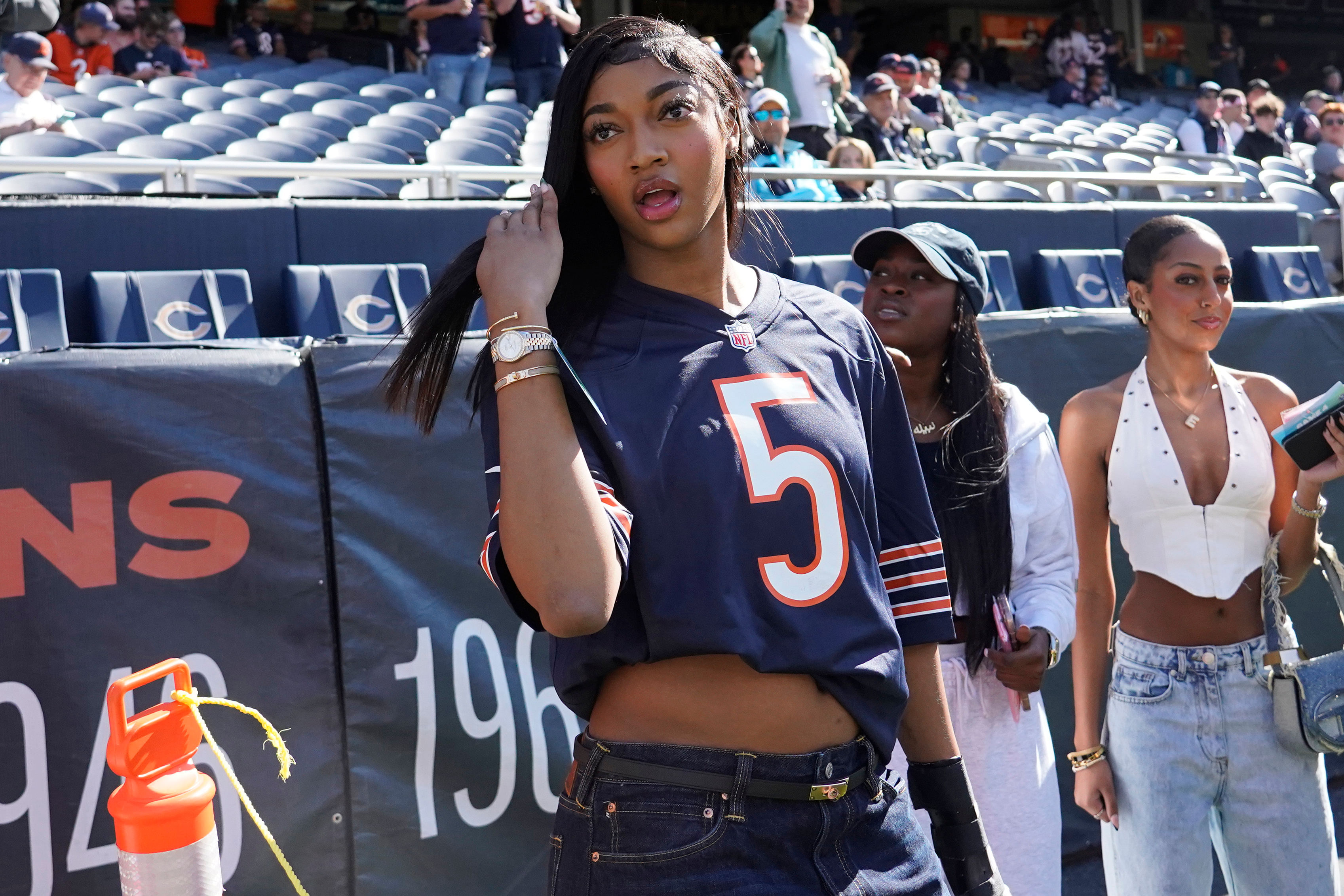 Chicago Sky player Angel Reese on the sidelines before the game between the Chicago Bears and the Carolina Panthers at Soldier Field. Photo Credit: Imagn