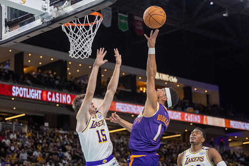 LA Lakers guard Austin Reaves defending Phoenix Suns star Devin Booker in NBA Preseason game - Source: Imagn