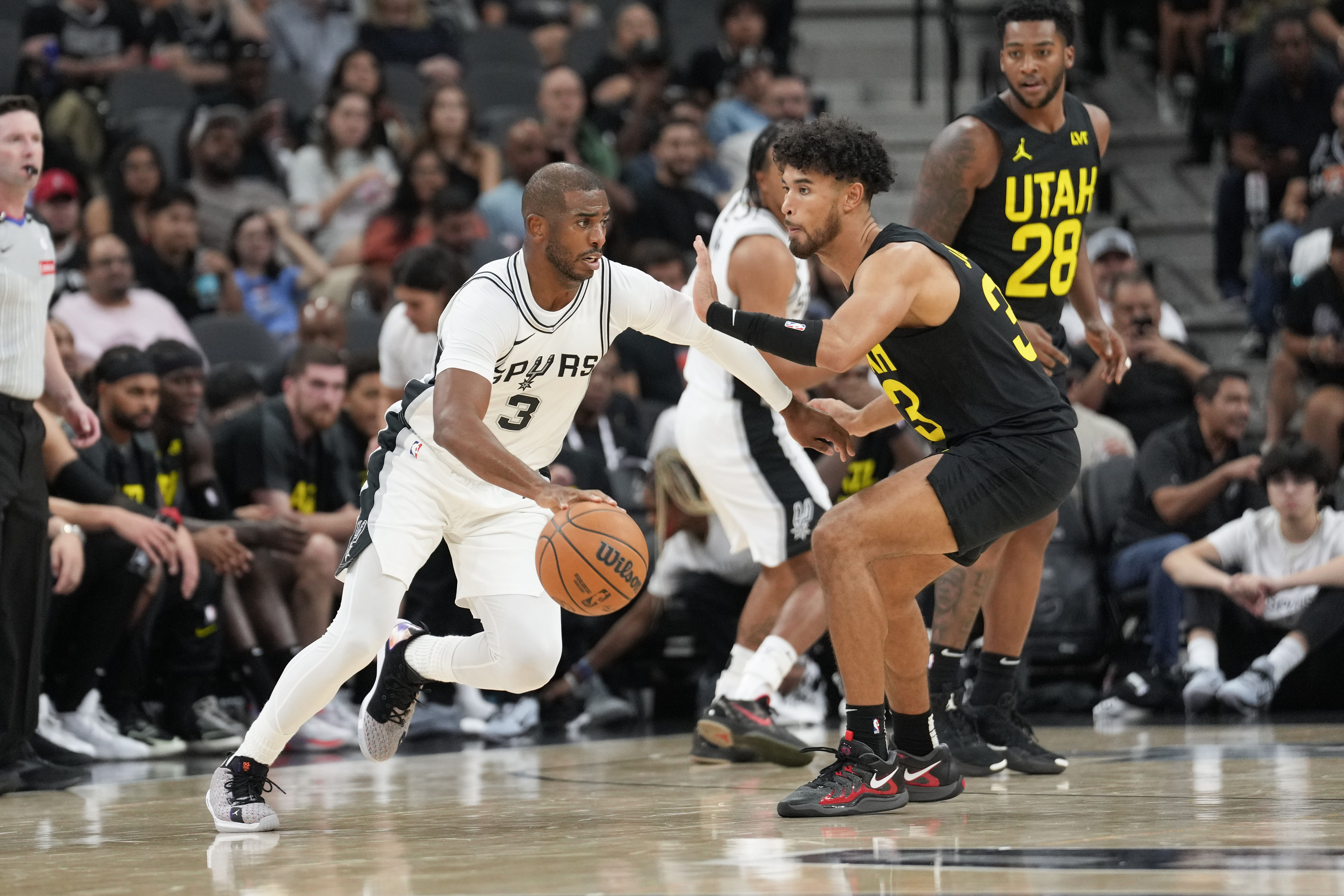 San Antonio Spurs guard Chris Paul dribbles against Utah Jazz guard Johnny Juzang at Frost Bank Center. Photo Credit: Imagn