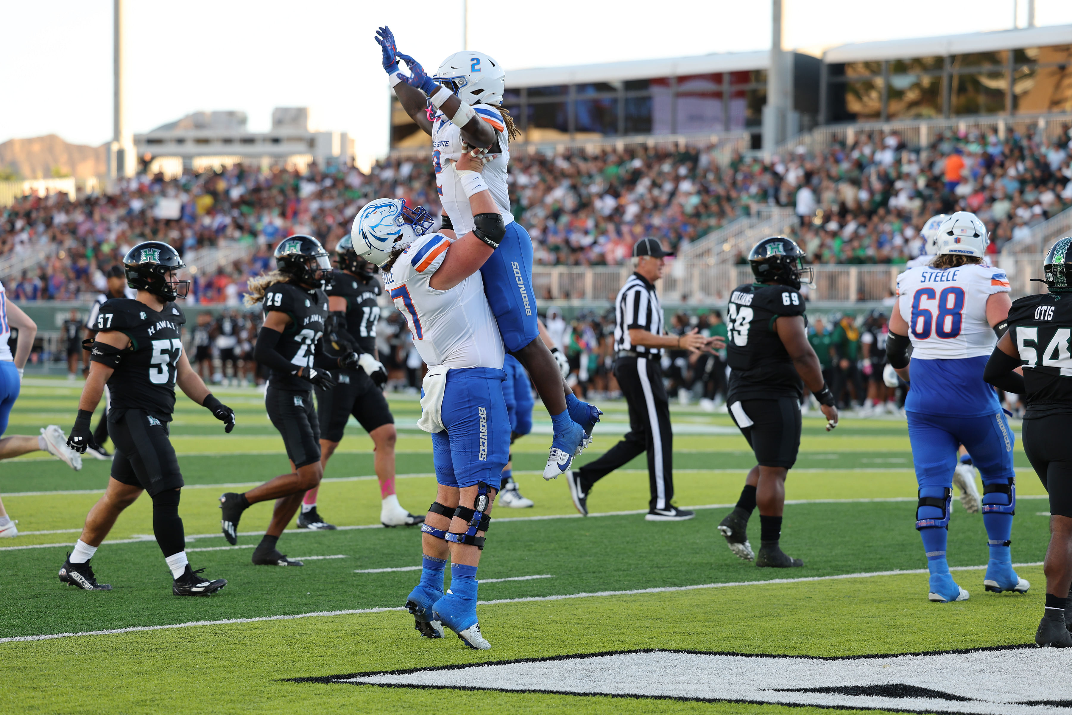 Boise State Broncos offensive lineman Jason Steele (67) picks up running back Ashton Jeanty (2) - Source: Imagn